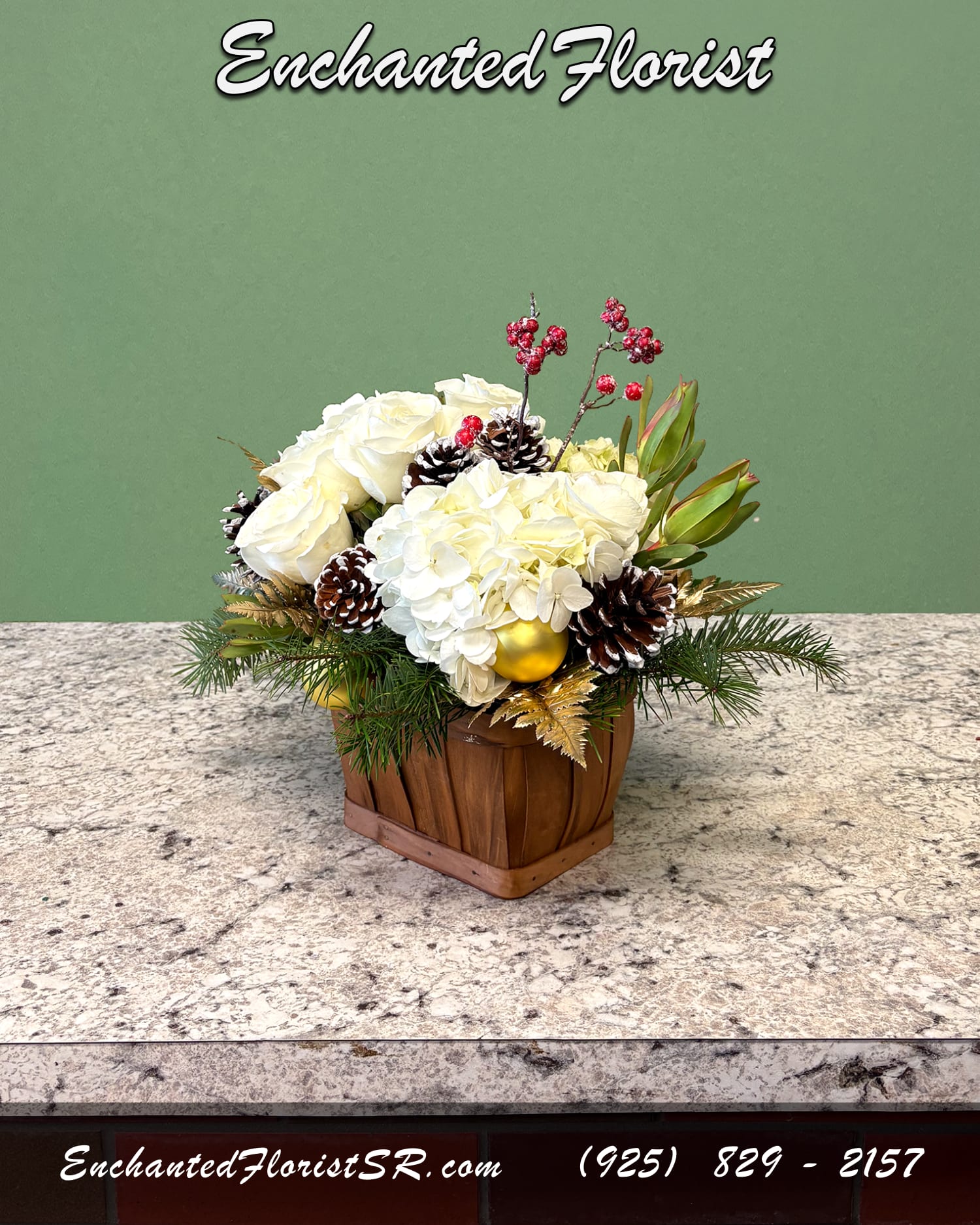 Woodland Winter - Holiday Arrangement - A charming seasonal arrangement inspired by the peaceful beauty of a tranquil snowy forest. Featuring elegant flowers such as roses and hydrangeas. Accented with gold-sprayed leather fern, safari sunset, and snowy decorative accents. Presented in a natural wooden basket, it brings a cozy woodland touch to holiday decorating.  Perfect for gifting, brightening a table, or adding winter charm to any space.  Orientation: All-Around  Arrives In: Natural wooden basket  Approximate Dimensions: 10" Tall 9" Wide