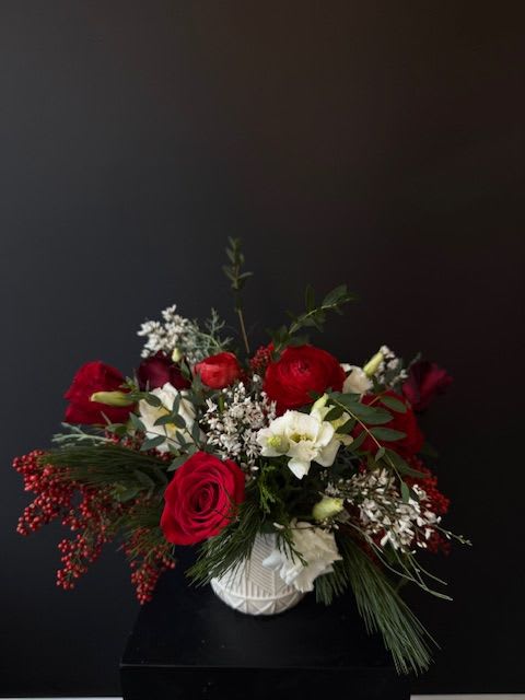 HOLIDAY. Designers Choice Vase Arrangement - A fun, festive arrangement designed in our signature SAGE style, featuring creamy whites, rich reds, and deep burgundies, accented with beautifully fragrant winter greens.