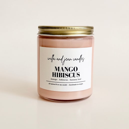 Willa and Jean - Mango Hibiscus 8oz. - Mango Hibiscus is sunshine in a candle—a vibrant blend of juicy mango, tropical hibiscus, and fresh banana leaf. Inspired by childhood vacations to my grandparents' Florida home, where my grandma would place a fresh hibiscus in my room each morning. Bright, fruity, and uplifting, this scent instantly transports you to your own sunny escape.