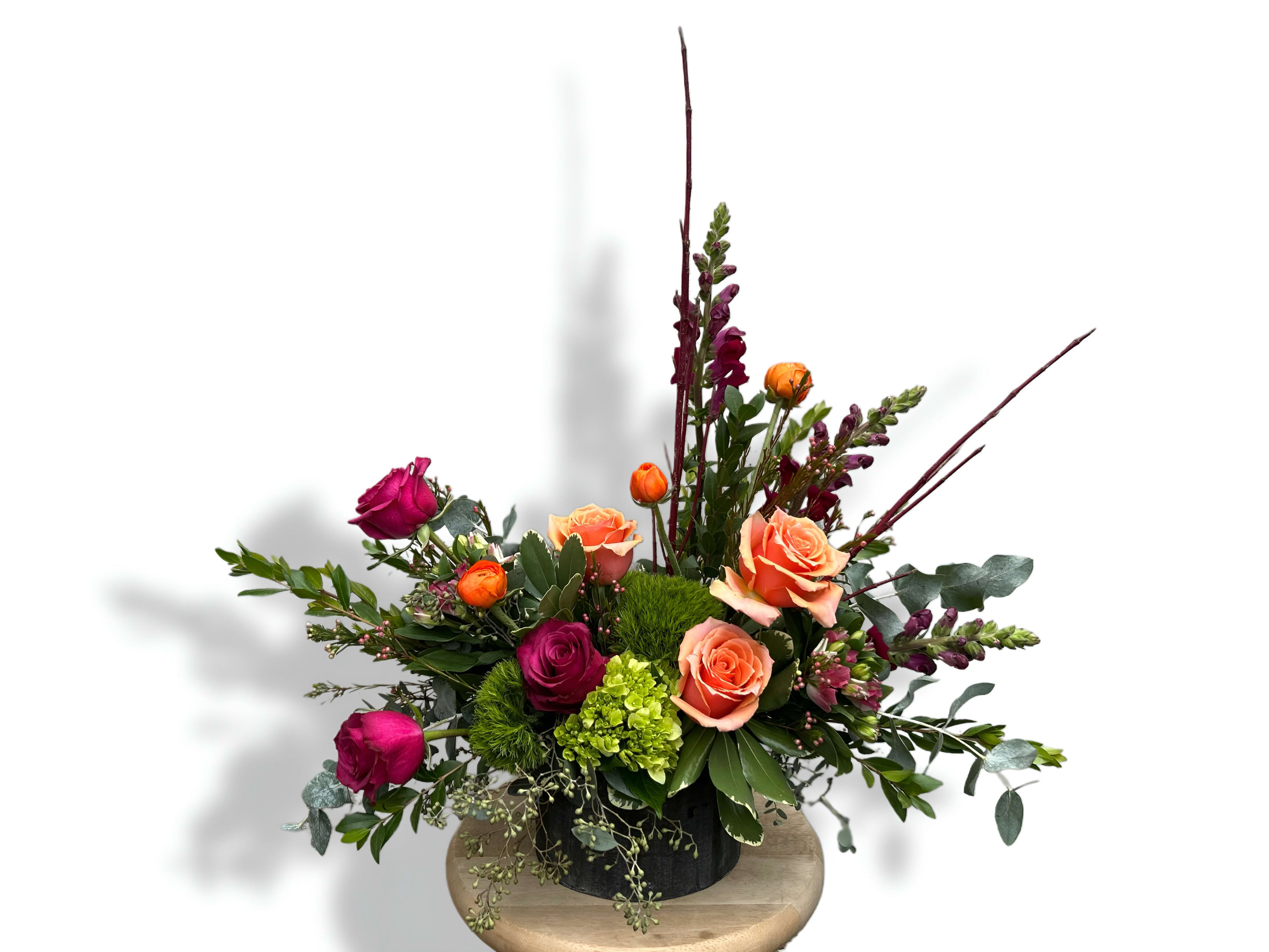 Rusted Rose - Like an heirloom rediscovered, Rusted Rose speaks to the beauty of imperfection and the poetry of time. Coral and wine-toned blooms meet the earthy textures of moss and foliage, creating a harmony between decay and renewal. Every petal feels sun-warmed and storied, evoking the faded glow of autumn afternoons and antique metal kissed by years.  Rusted Rose is both strength and softness — a piece for the dreamers, the collectors, and those who find elegance in the undone.