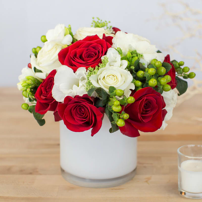 Holiday Cheer Arrangement - This arrangement is perfect to tie in with any holiday decor and bringing the holiday spirit to your home. 