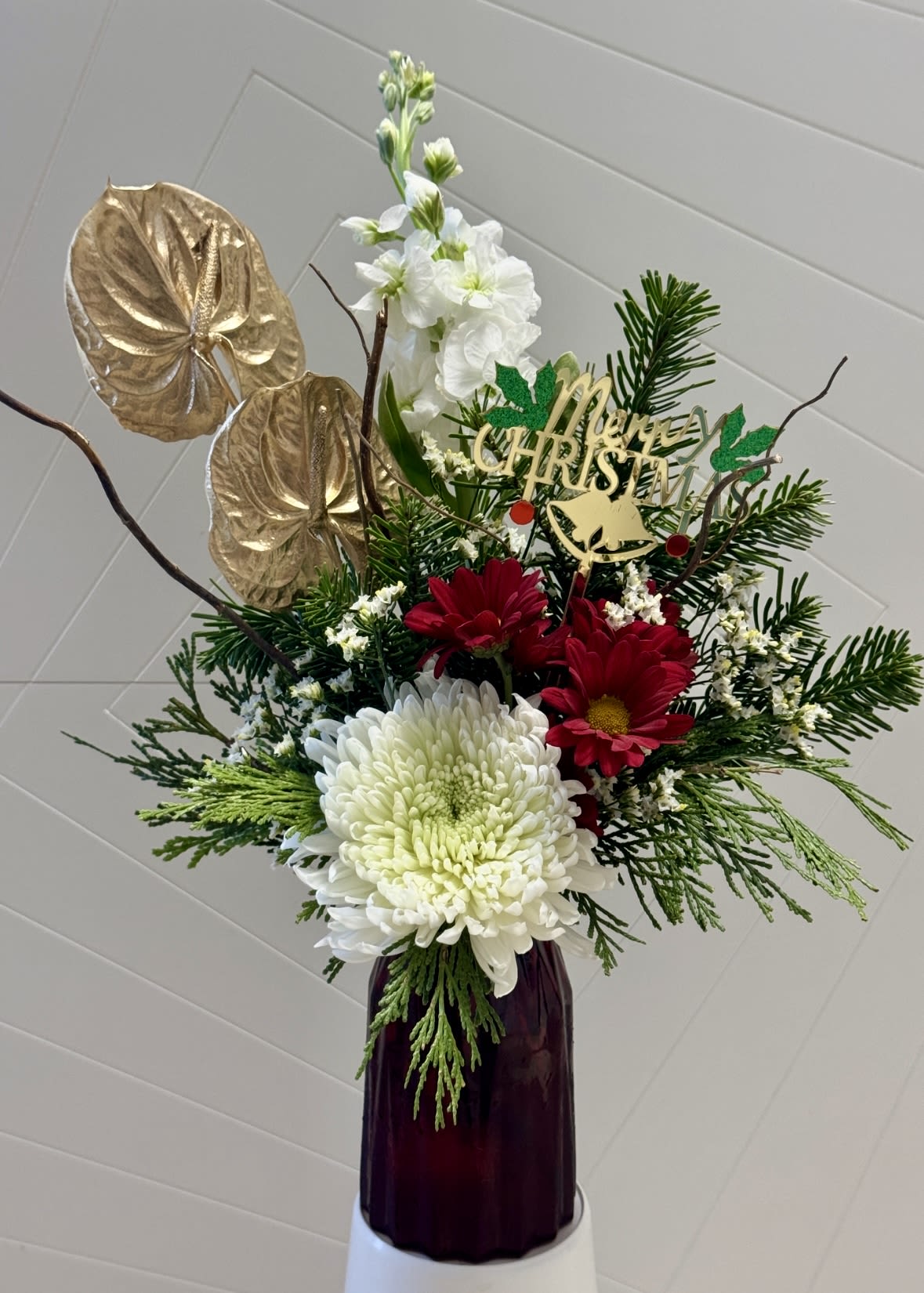 Bliss Holly Jolly - A classic Christmas floral design with reds, greens, and natural textures that bring warmth and happiness to any home or office. Pick included.
