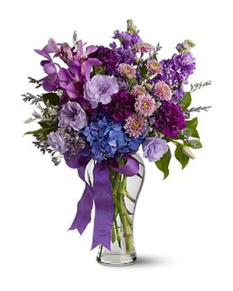 Amazing Grace - A spectacular mix of fresh, fragrant blossoms in cool shades of lavender, purple and blue - accented with a matching purple ribbon - is a study in amazing grace and beauty. At almost two feet tall, it's a striking gift for any special occasion, or just because. A mix of blue, purple and lavender flowers such as Mokara orchids, hydrangea, lisianthus, lavender and button spray chrysanthemums is arranged in a clear glass vase, adorned with a deep purple ribbon. Approximately 15.5" (W) x 23.5" (H) Orientation: One-Sided As Shown : TFWEB370