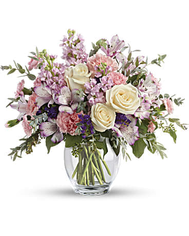 Pretty Pastel Bouquet - Oh so pretty! When you want to whisper your wishes for a wonderful occasion, send this pale pastel bouquet of roses alstroemeria, carnations and stock. This pretty arrangement includes crème roses, lavender alstroemeria, pink carnations, miniature pink carnations, pink stock, purple sinuata statice, parvifolia eucalyptus, and seeded eucalyptus. Delivered in Teleflora's Clear Glass Ginger Jar. Orientation: All-Around