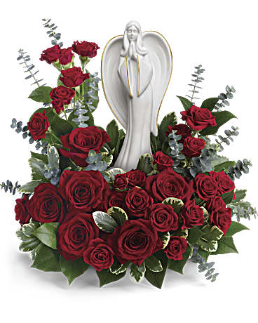 Forever Our Angel Bouquet - This peaceful porcelain angel sculpture, surrounded by radiant red roses and delicate greenery, is a touching tribute to a rich life. This radiant bouquet includes red roses, red spray roses, spiral eucalyptus, variegated pittosporum, and lemon leaf. Delivered with an Angel of Grace Keepsake.