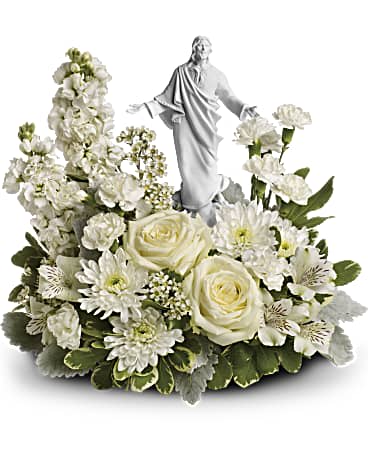 Forever Faithful Bouquet - An elegant display of faith and grace, this beautiful arrangement will comfort the bereaved in a truly thoughtful and respectful way. An exquisite sculpture of Jesus is surrounded by a bed of lovely blossoms. It is sure to be appreciated and always remembered. A fragrant mix of pure white blooms - including roses, alstroemeria, stock, carnations and waxflower - is accented with dusty miller and variegated pittosporum. Delivered with an exclusive Sacred Grace keepsake.
