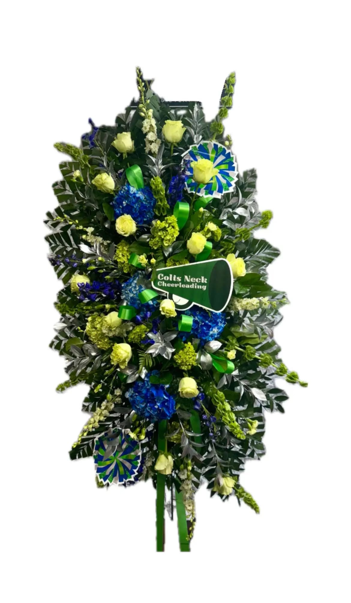 Cheerleading Themed Spray - Celebrate the spirit of your loved one with this vibrant standing spray. Lovely flowers such as Roses, white snapdragon, larkspur, blue hydrangea and Bells of Ireland, set amidst ferns. Orientation: One-Sided All prices in USD ($)