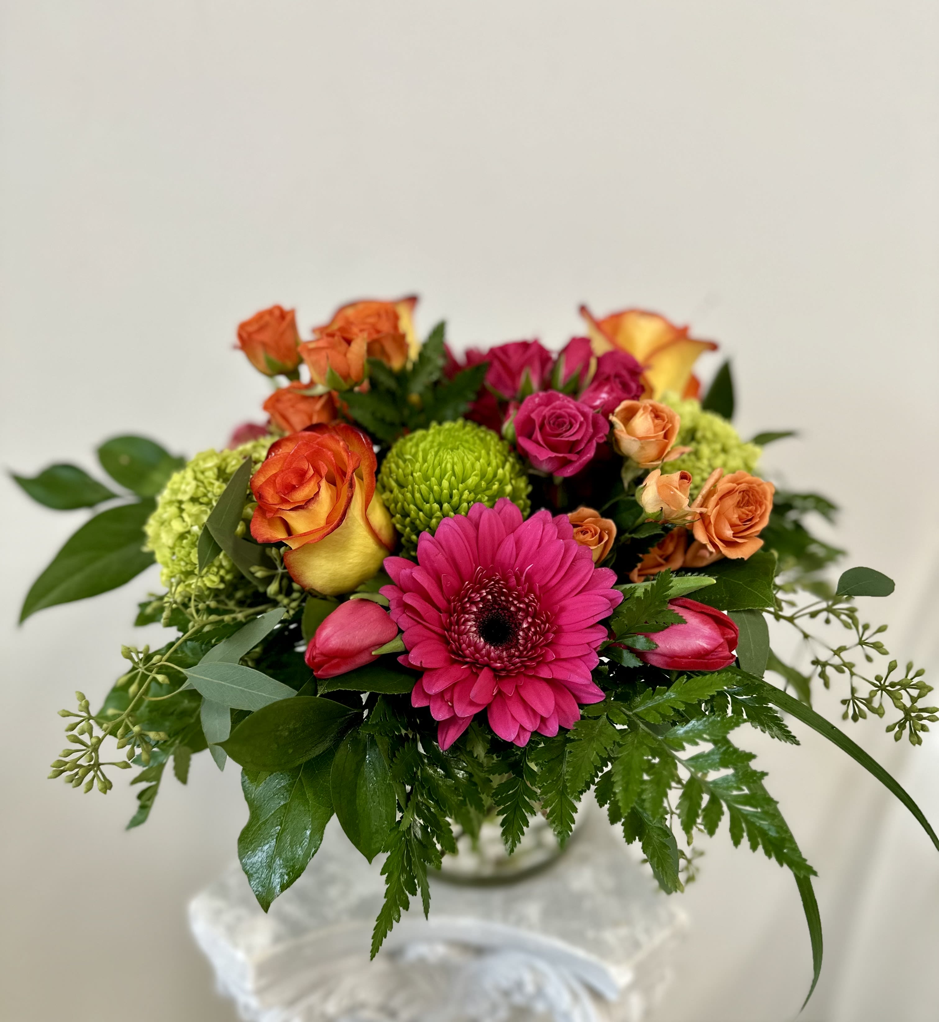 Felicity by Westford Florist Art by Veny - Experience the enchanting beauty of Felicity by Westford Florist Art by Veny, an exquisite flower arrangement designed to elevate any environment into a vibrant oasis. This stunning bouquet showcases a captivating symphony of bold colors and diverse blossoms, creating an eye-catching centerpiece that brings joy and warmth to both home and office settings. Each carefully selected flower harmonizes perfectly with the others, ensuring that Felicity not only brightens your day but also uplifts your spirit. Perfect for gifting or treating yourself, this arrangement is a celebration of nature’s artistry that will leave a lasting impression. Transform your space today with the timeless elegance of Felicity. Felicity flower arrangement has been thoughtfully designed to bring both visual beauty and emotional delight. Its mesmerizing presence can easily transform any space into a flourishing botanical paradise where one can escape from the stressors of daily life and find solace in nature's tranquility. Whether you're looking for something spectacular for yourself or searching for the perfect gift for a loved one, Felicity flower arrangement by Westford Florist is an excellent choice. Immerse yourself in the beauty of nature and experience the joy it brings with this vibrant and uplifting floral bouquet.