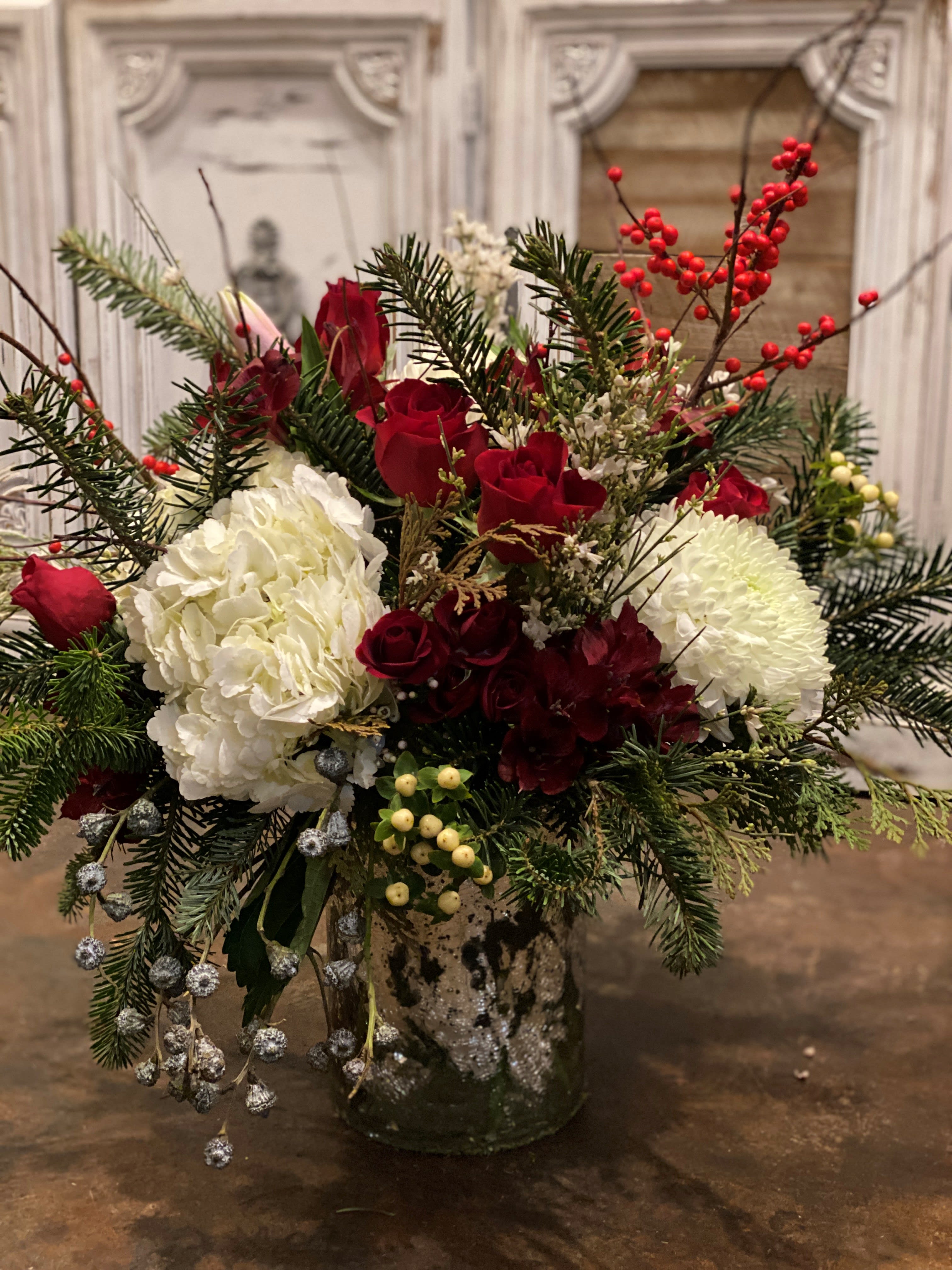 Red and White  - Holiday flowers and greenery, joyful arrangement will bring warmth and happiness to anyone home for the  season.( One sided design) 
