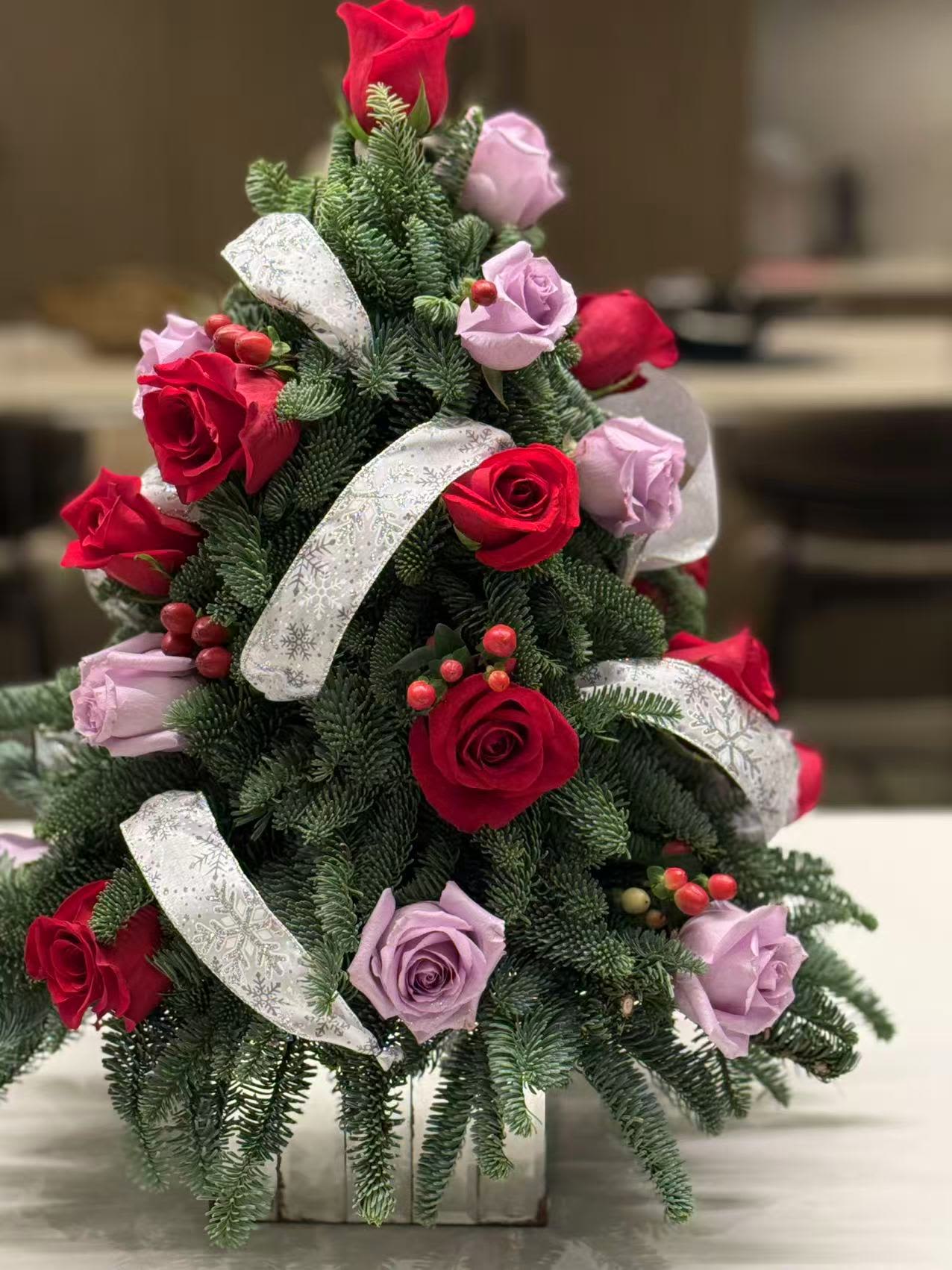 Xmas Tree Centerpieace  - This beautiful tabletop Xmas tree arrangement will sure bring the holiday spirit to your table. Makes a wonderful addition to your décor, or send as a gift to share tidings of good cheer.