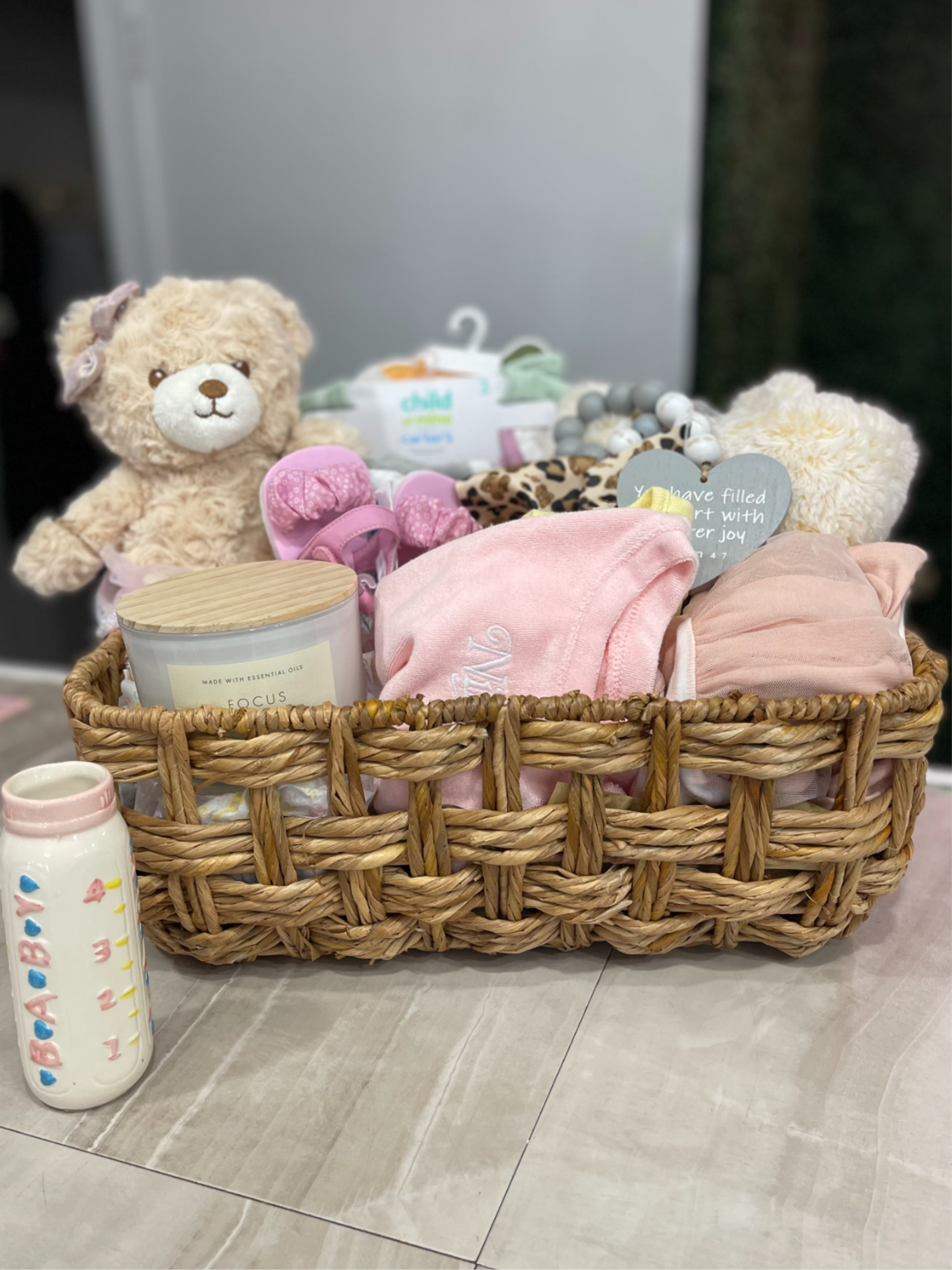 Hello Baby Girl Basket - Welcome the newest little baby girl home with a gift basket bursting with sweetness, snuggles, and smiles!  This ultra-adorable baby gift set is packed with cozy essentials for the baby and a candle for the parents. From a super-soft starry blanket to a sweet plush unicorn and a bottle vase that will be filled with fresh flowers a basket is the perfect way to say “Congratulations!” 
