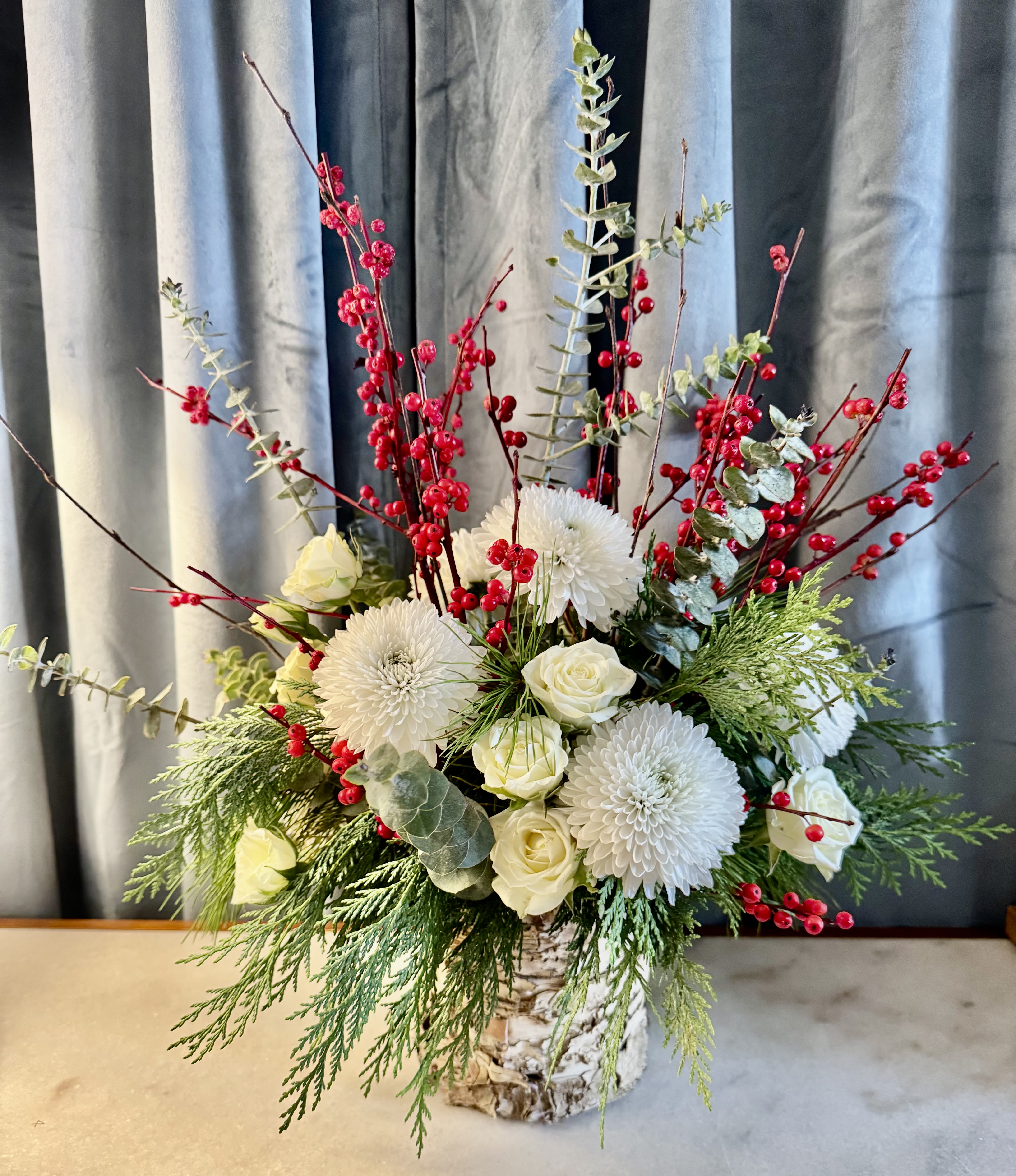 Hygge Winter - Welcome a cozy winter wonderland right into your home by creating a Hygge-inspired winter arrangement. Get ready to snuggle up with your loved ones amidst the warm and fuzzy vibes of the season! 