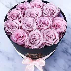 Fresh Rose box dozen - Beautifully arranged fresh roses in a gorgeous  round box with a lid. Roses will be set in floral foam to keep them looking fresh.