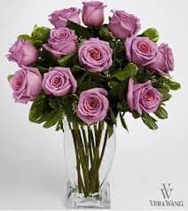 Father of the Brite - Dozen lavender roses in a glass vase with a nice greenery 