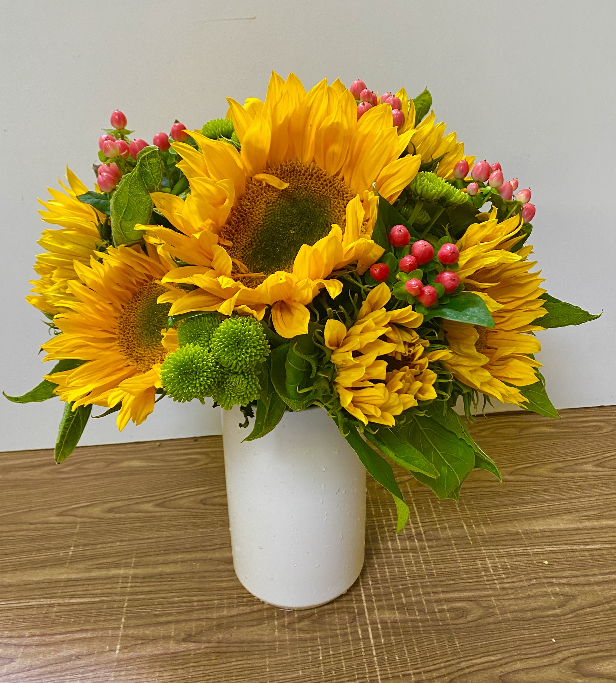 The Princess Bride  - Bright, cheerful, and full of sunshine, this arrangement features seven radiant sunflowers beautifully displayed in a sleek white ceramic vase. Known for their bold golden petals and uplifting presence, sunflowers symbolize happiness, warmth, and positivity, making this design the perfect gift to celebrate life’s joyful moments. Whether you’re sending flowers for a birthday, a “get well soon” surprise, or simply to brighten someone’s home, these vibrant blooms are sure to bring a smile.  The crisp white ceramic vase adds a touch of modern elegance, complementing the natural beauty of the sunflowers while making the arrangement easy to display in any setting. Its clean design ensures the flowers remain the focal point, creating a timeless piece that suits both casual and formal occasions.  Handcrafted with care by Jane’s Roses, your trusted San Francisco florist, this sunflower arrangement is designed with fresh, high-quality stems sourced daily to guarantee lasting beauty. Perfect for homes, offices, or as a thoughtful gift, it captures the essence of summer and joy in a simple yet striking way.  With fast and reliable flower delivery throughout San Francisco, Jane’s Roses makes it easy to send sunshine straight to someone’s door. Order today to share the natural beauty and radiant charm of sunflowers, carefully arranged in a stylish ceramic vase and delivered with love from your local San Francisco florist.