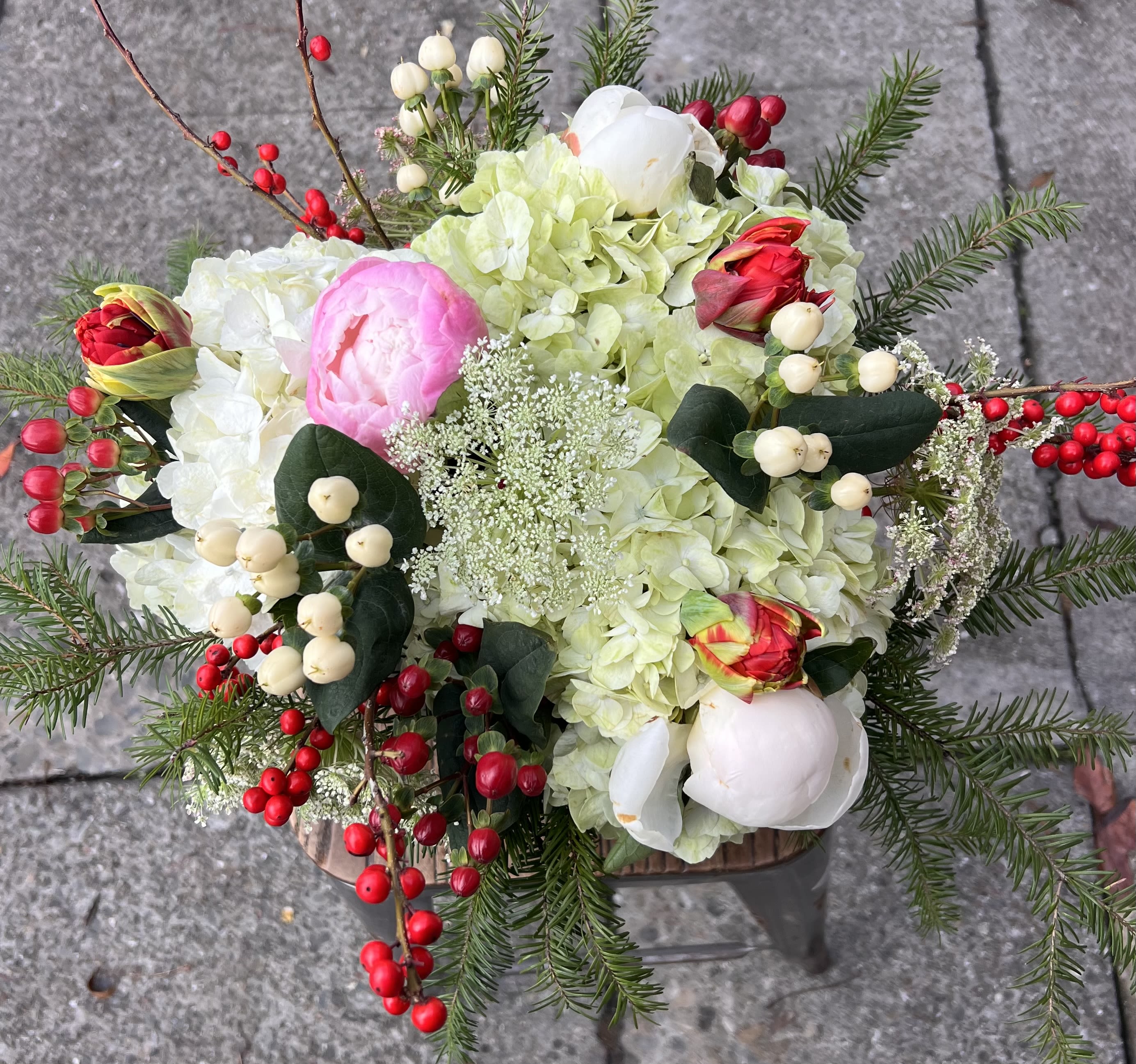 Snowfall Holiday  - Like watching snow fall from a warm window — soft, romantic, and full of feeling. Peonies, winter berries, and hydrangeas create a bouquet that feels like a holiday memory you get to hold in your hands.