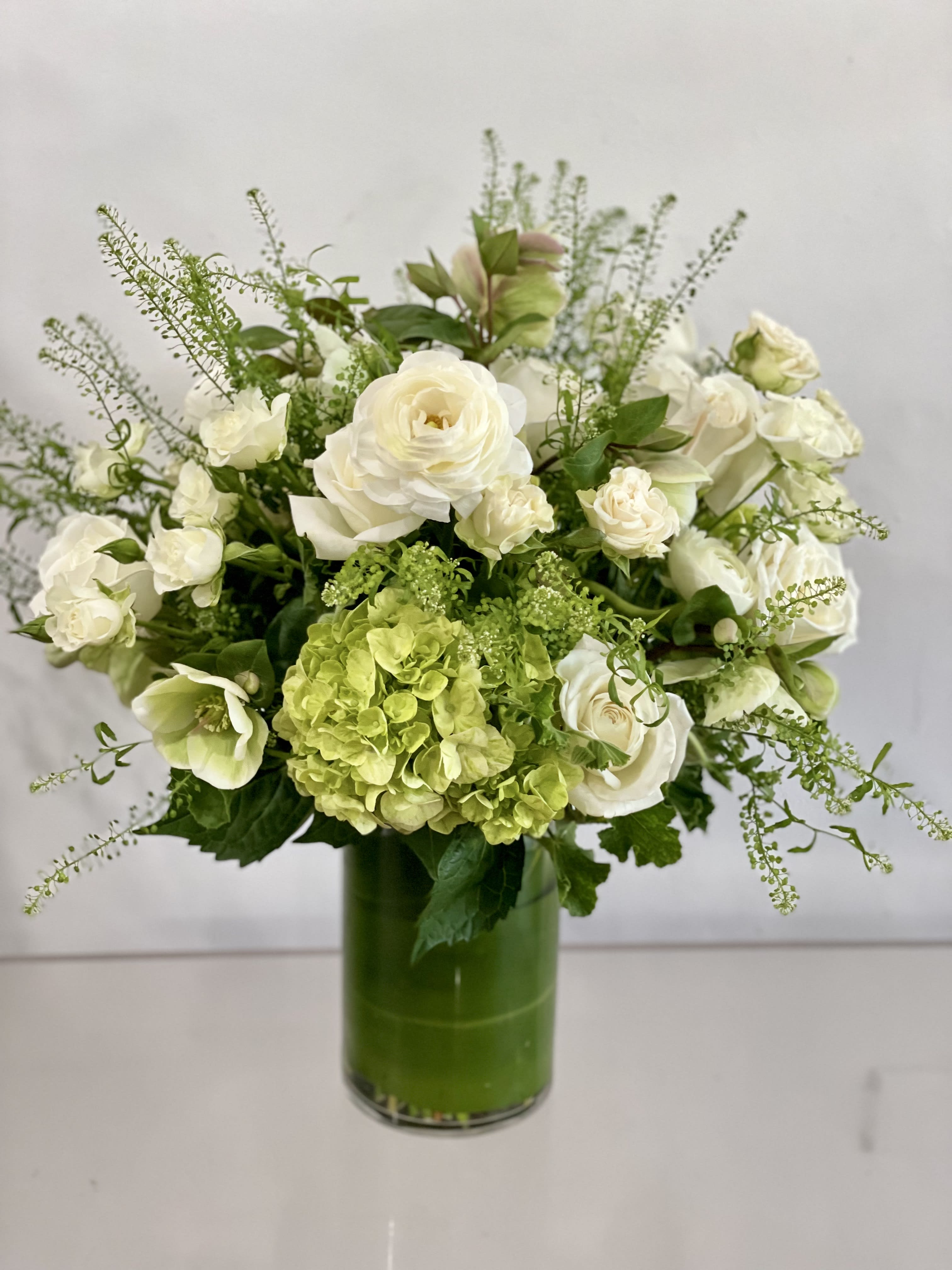 Neutral Number - Tall green and white arrangement of premium blooms in a tall vase. For an entryway or credenza. Let us choose beautiful flowers to make a great impression!   NOTES: We will choose the freshest and most interesting ingredients at the market to make this arrangement shine. Vessels may be substituted depending on availability.   Saturday and Same Day are available if you call the shop.   ** 415 751 2747 10:00AM -5:00PM MOTHER'S DAY DELIVERIES ARE LIMITED SO ORDER EARLY! PLEASE CALL THE SHOP TO PLACE ORDER IF THEY NEED TO BE TIMED*     