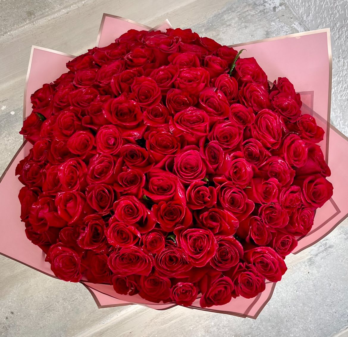 100 Long Stem Roses  - One hundred gorgeous long stem roses delicately wrapped in craft paper.  Send the best flowers from the best florist in Jupiter.  Handwritten card is included.  Send the most beautiful flowers for that special someone.  Next day delivery available to Tequesta, Jupiter, Palm Beach Gardens and Palm Beach.  Red will be chosen unless another color is specified.  Thank you!