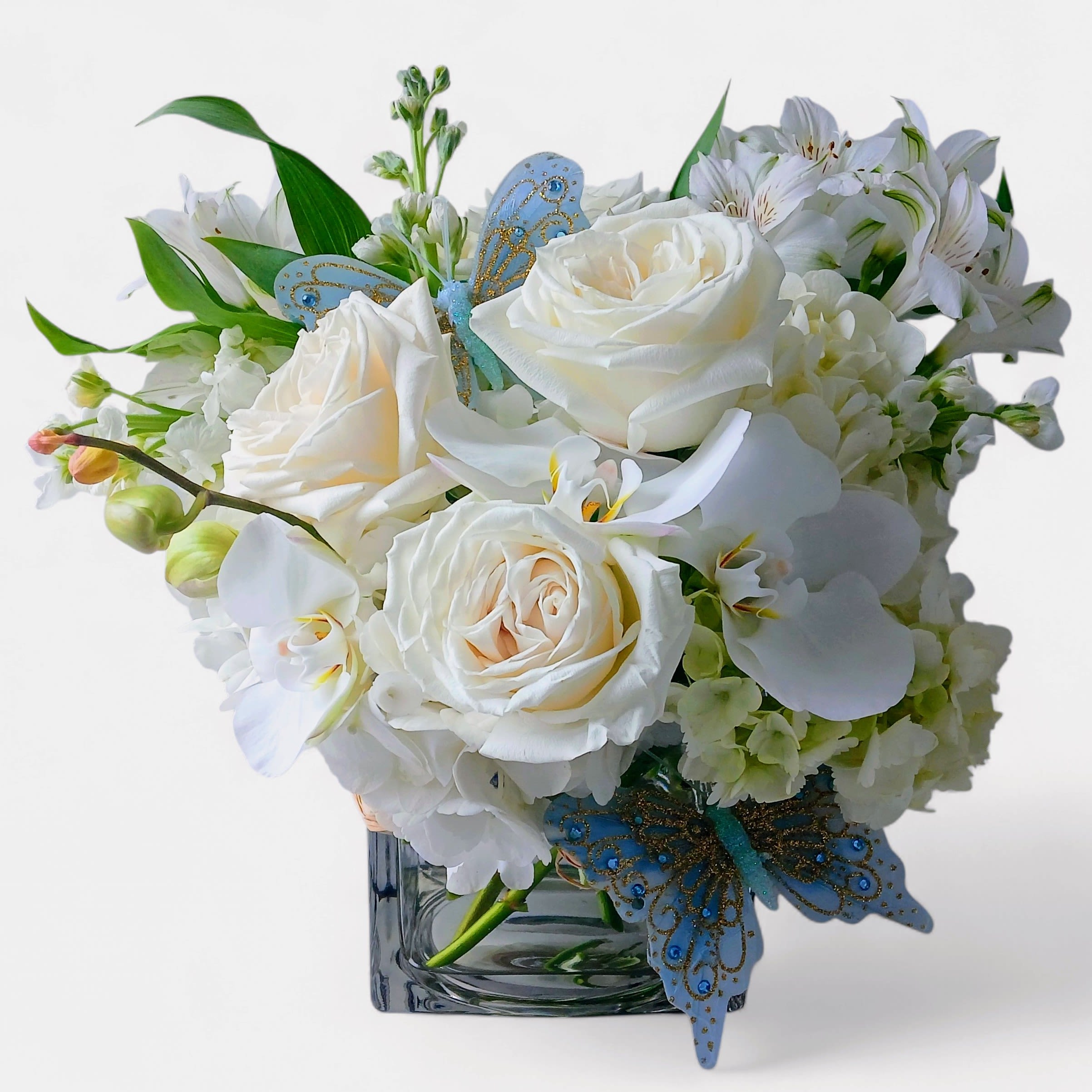 Every Occasion Bouquet Designer's Choice - Designer's choice; made beautifully from my pastel blossom selection of the day roses orchids and more arranged in a modern glass cube style vase. Perfect for every occasion to show them how much you care. Always made unique and extra special each and every time. Send them happiness.