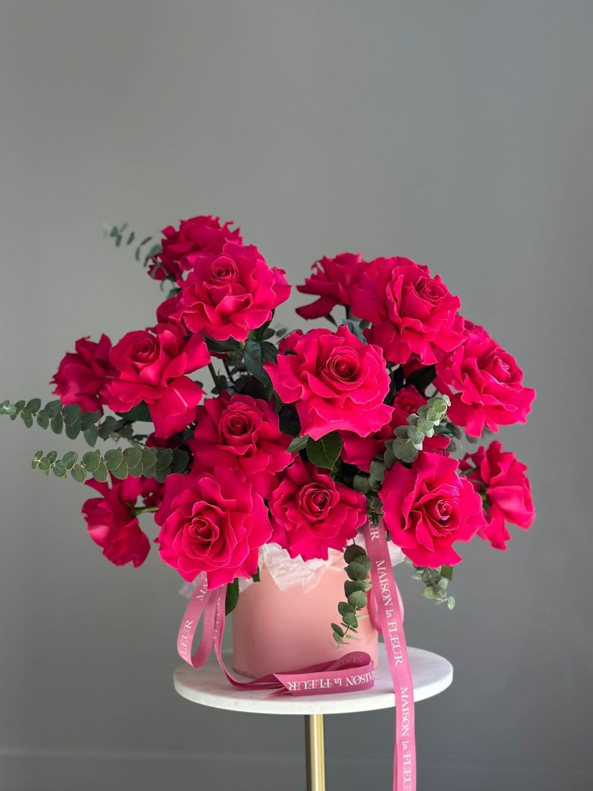 Pink Attraction Bouquet - Pink Attraction features 25 premium long stem roses from Ecuador, carefully hand-opened to showcase their full, lush beauty. Complemented by fragrant eucalyptus sourced from California, this bouquet exudes elegance and romantic charm. This arrangement is perfect for expressing admiration, love, or simply making a lasting impression. 