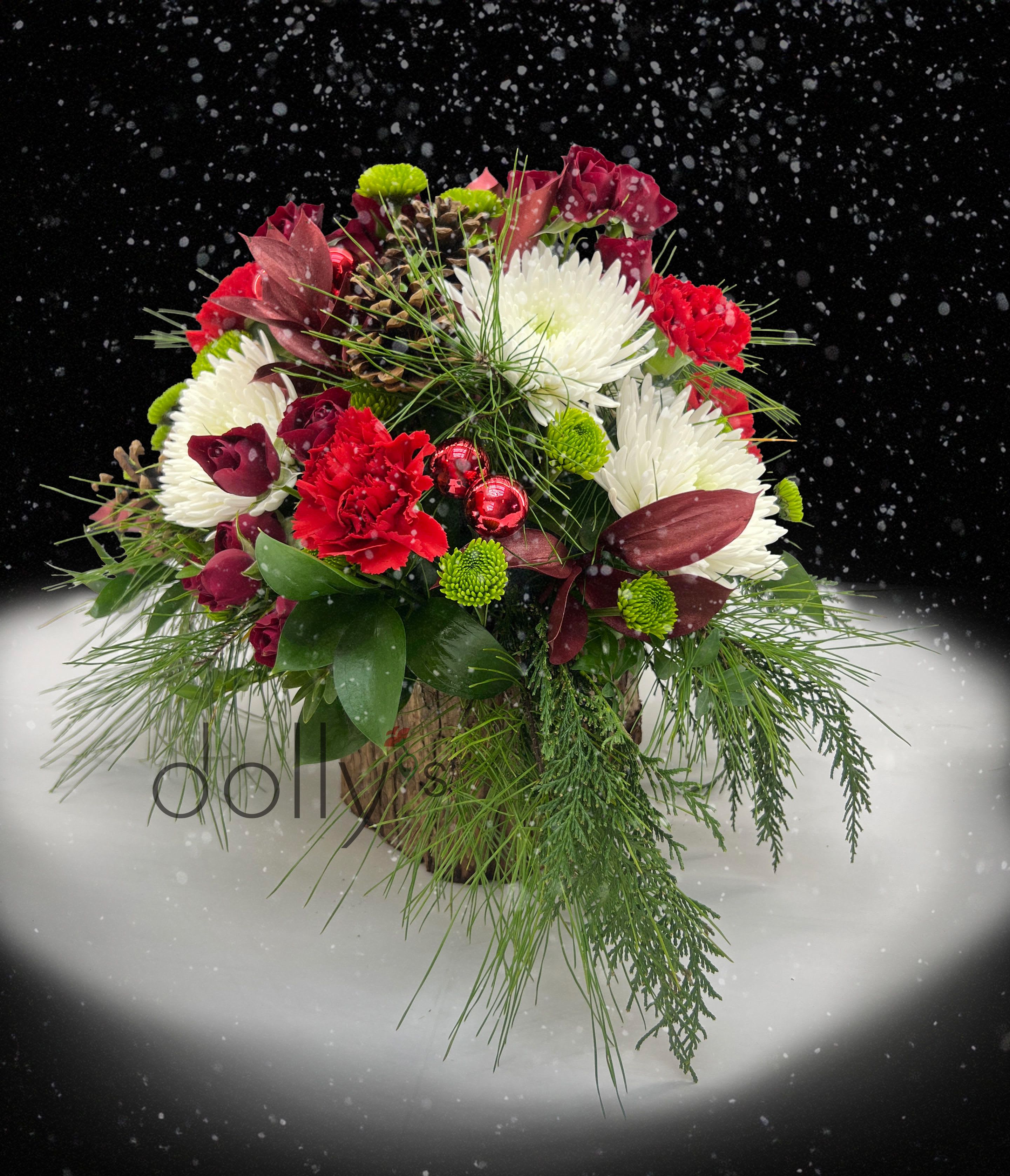 SOLD OUT | Yule Log | Deluxe - A festive arrangement composed in a bark vase.
