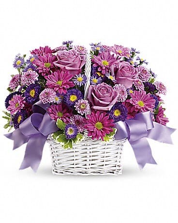 Daisy Daydreams - Get a handle on spring with this delightful array of floral favorites in a charming white bamboo basket accented with lavender ribbon. Surprise someone who could use a lift. It will make you both happy. The cheerful bouquet includes lavender daisy spray chrysanthemums, dark purple Matsumoto asters, lavender cushion spray chrysanthemums and purple Monte Cassino asters accented with fresh greenery. The flowers are delivered in a white bamboo basket accented with a lavender gingham ribbon.