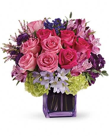 Exquisite Beauty  - No other name could possibly describe this exquisitely beautiful bouquet. Its brilliant blossoms are gorgeously arranged and delivered in an exclusive lavender vase. Let her know how special she is to you by sending this fabulous gift. Dazzling green hydrangea, hot pink and light pink roses, purple alstroemeria, mini carnations and statice, lavender freesia, pink heather and eucalyptus arrive in a lavender cube. Exquisitely exciting!