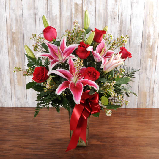 Stargazers &amp; Roses - Perfect red roses with Stargazer lilies arranged in a vase perfect for a Love occasion!