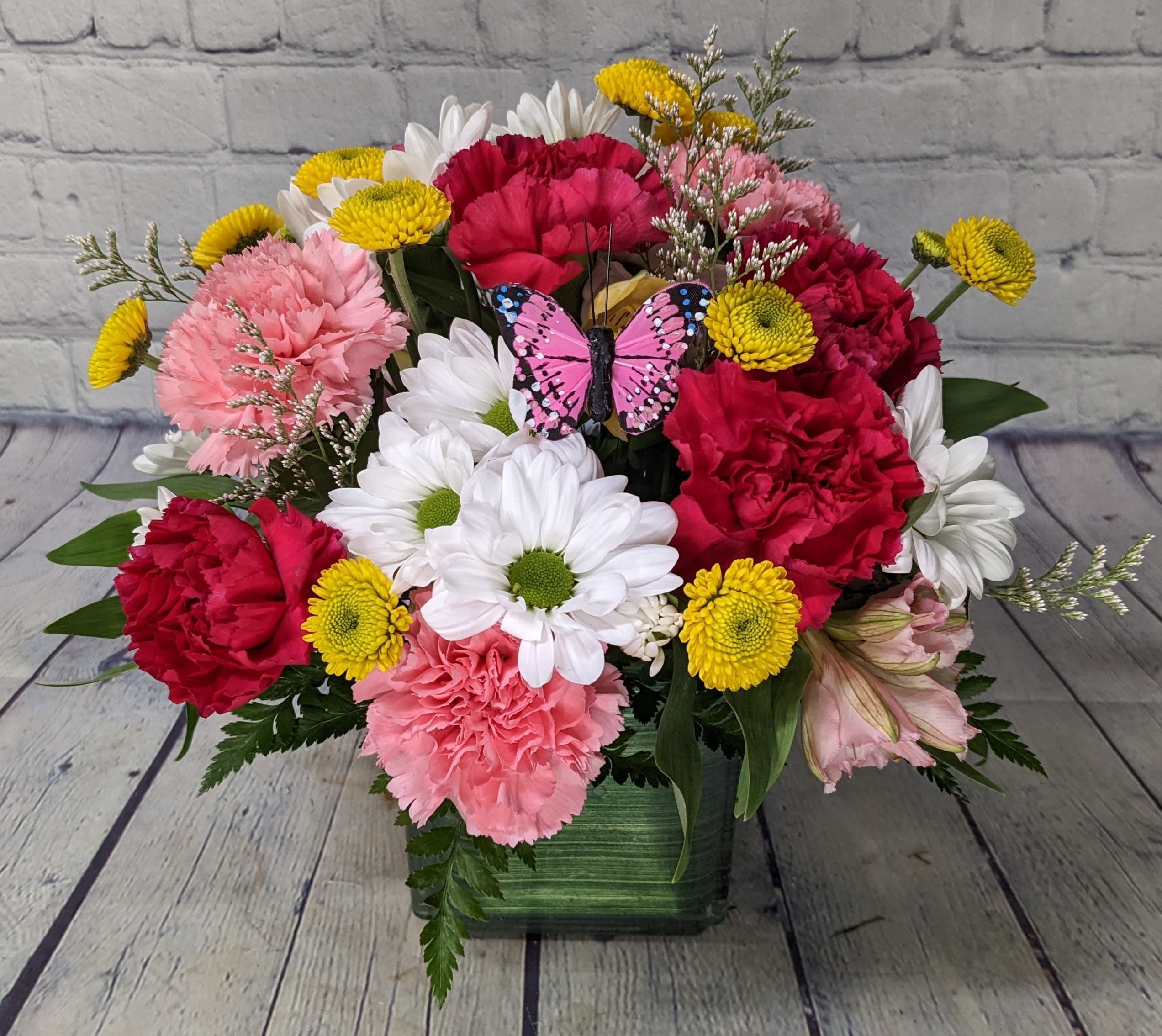 Love You Most - Love you more. Love you to the moon and back. Mom has been saying it for years, now it's your turn to tell her. This lovely bright bouquet is designed with long lasting blooms to say it over again and again, "I love you most". 