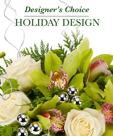 New Year's Designer's Choice  - Designer’s Choice New Year Arrangement  Add a touch of magic to your New Year celebrations with our remarkable Designer’s Choice Christmas Arrangement. Expertly crafted by our talented floral artists, this arrangement features:  Hand-selected, exquisite blooms chosen for their seasonal beauty and vibrant charm.  A stunning palette of warm colors paired with captivating textures, evoking the spirit of an abundant holiday harvest.  A centerpiece that takes center stage, captivating hearts with its timeless elegance and festive allure.  Every detail of the Designer’s Choice Arrangement is lovingly designed to enhance your gathering with a sense of gratitude and holiday cheer.   Its enchanting presence creates a welcoming ambiance, making your celebration truly unforgettable and leaving your guests feeling enchanted and thankful.  Celebrate the season with a masterpiece that embodies the Celebration of a New Year!