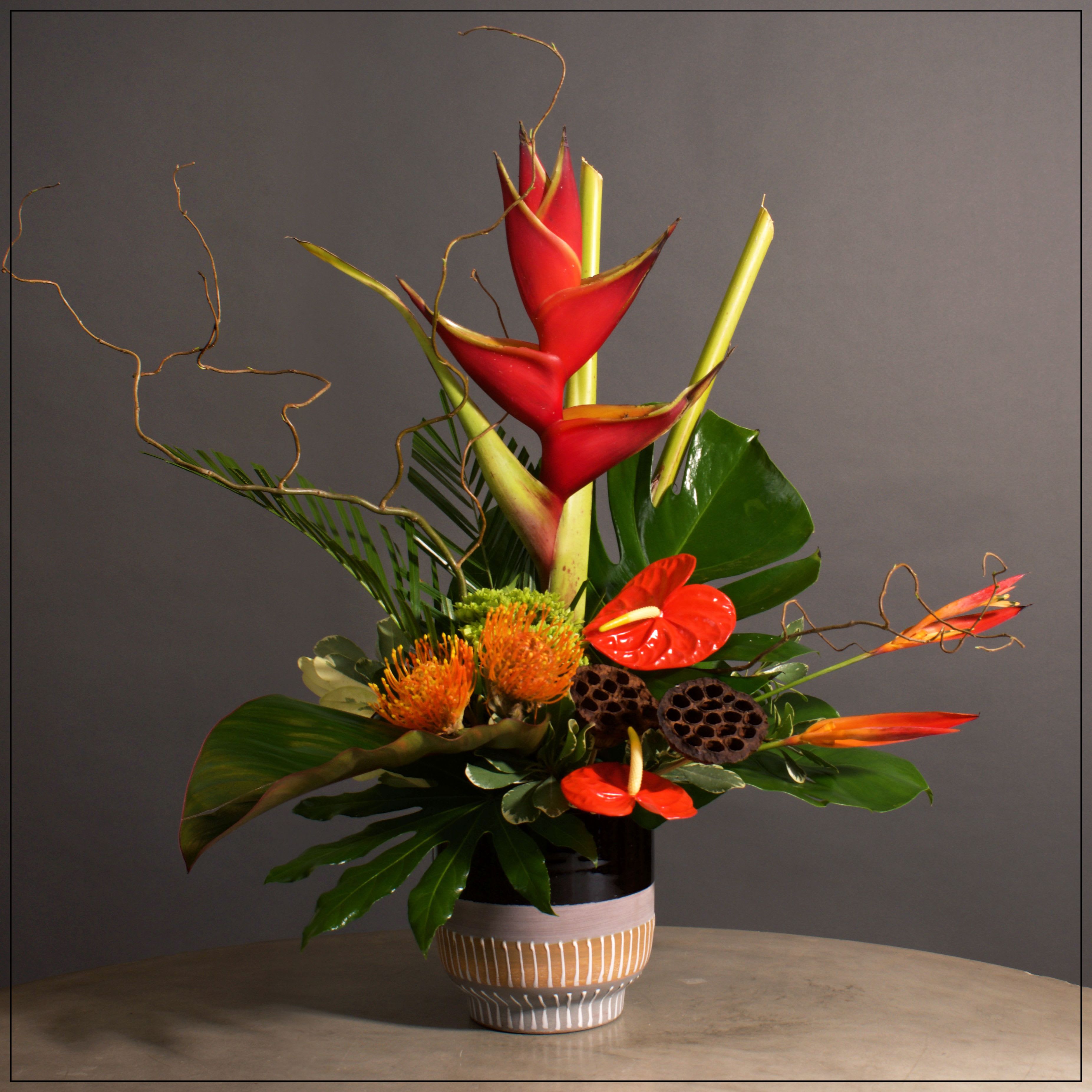 Bali - Phenomenal Exotic arrangement- Heliconia, Anthurium, Protea, Mini hydrangea, Lotus pods, and exotic foliages. Approximately 24" tall and 24" wide