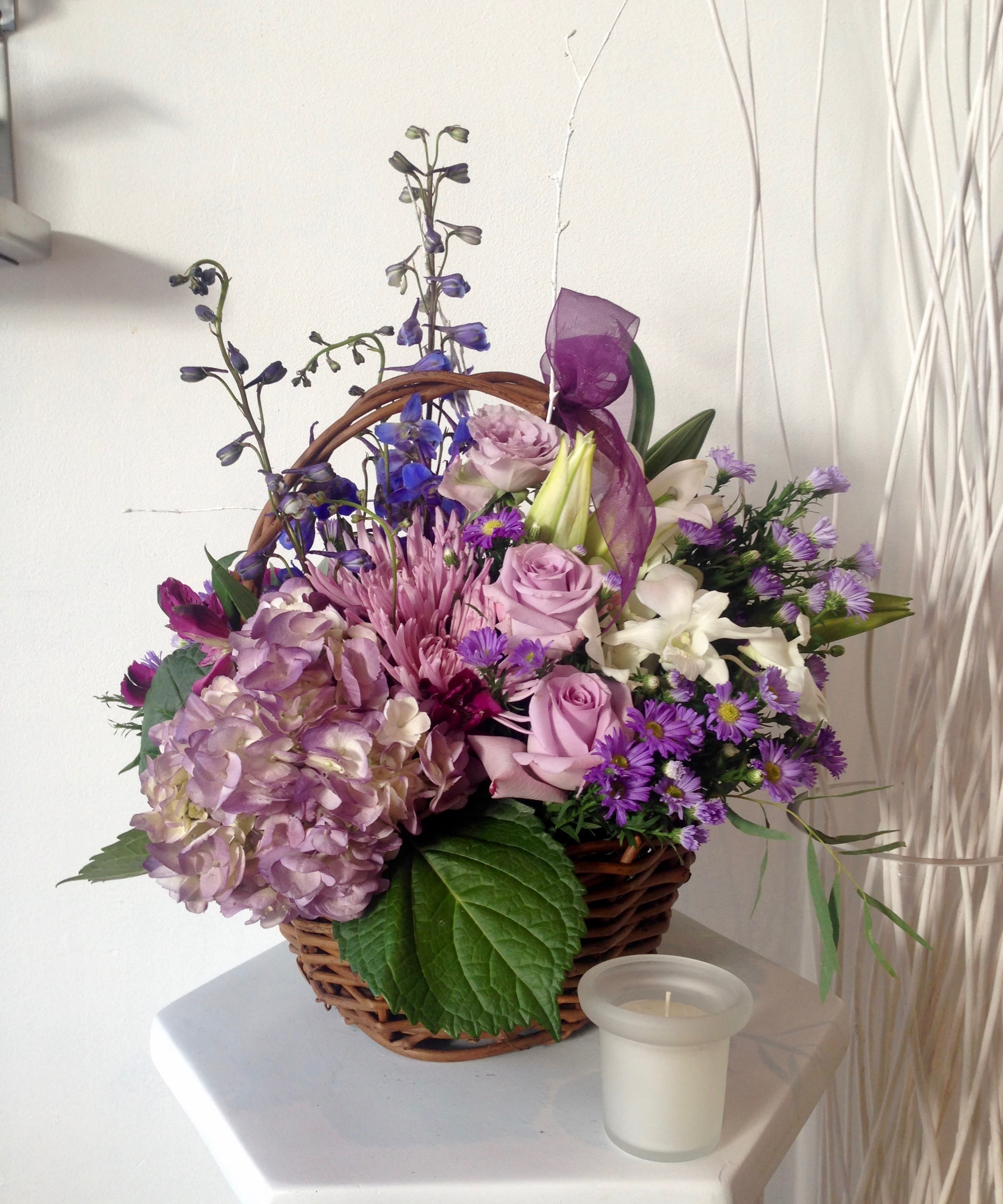 Lavender Love. A Floral Archist™ Design. - Lavender and lovely, our fresh-packed basket features roses, hydrangeas, daisies, alstroemeria, mums and others! All in a variety of purple tones. A Floral Archist™ original. Perfect for home recuperation, new baby, grandma’s birthday, office desk and many others.