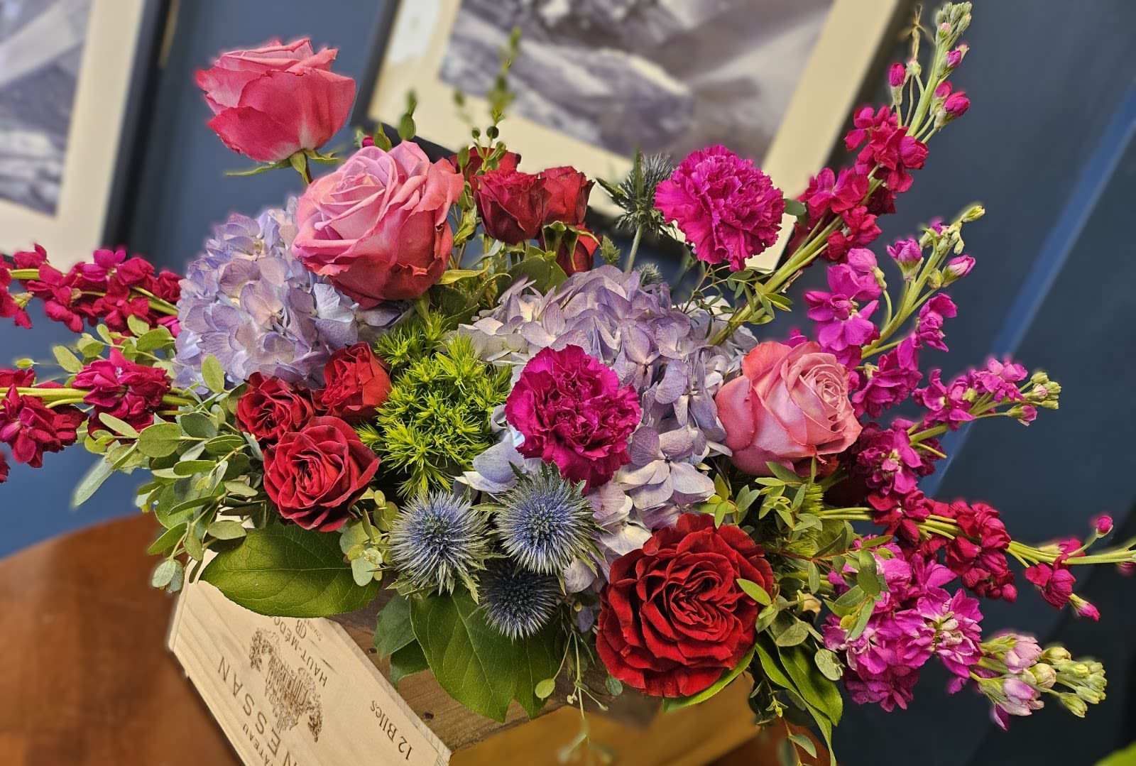 Cabernet  - Pulling rich tones of Cabernet Sauvignon as inspiration. Send this gorgeous mixed berry tones floral arrangement that come styled in a long wooden box! Perfect for end tables and the center of the dining table.