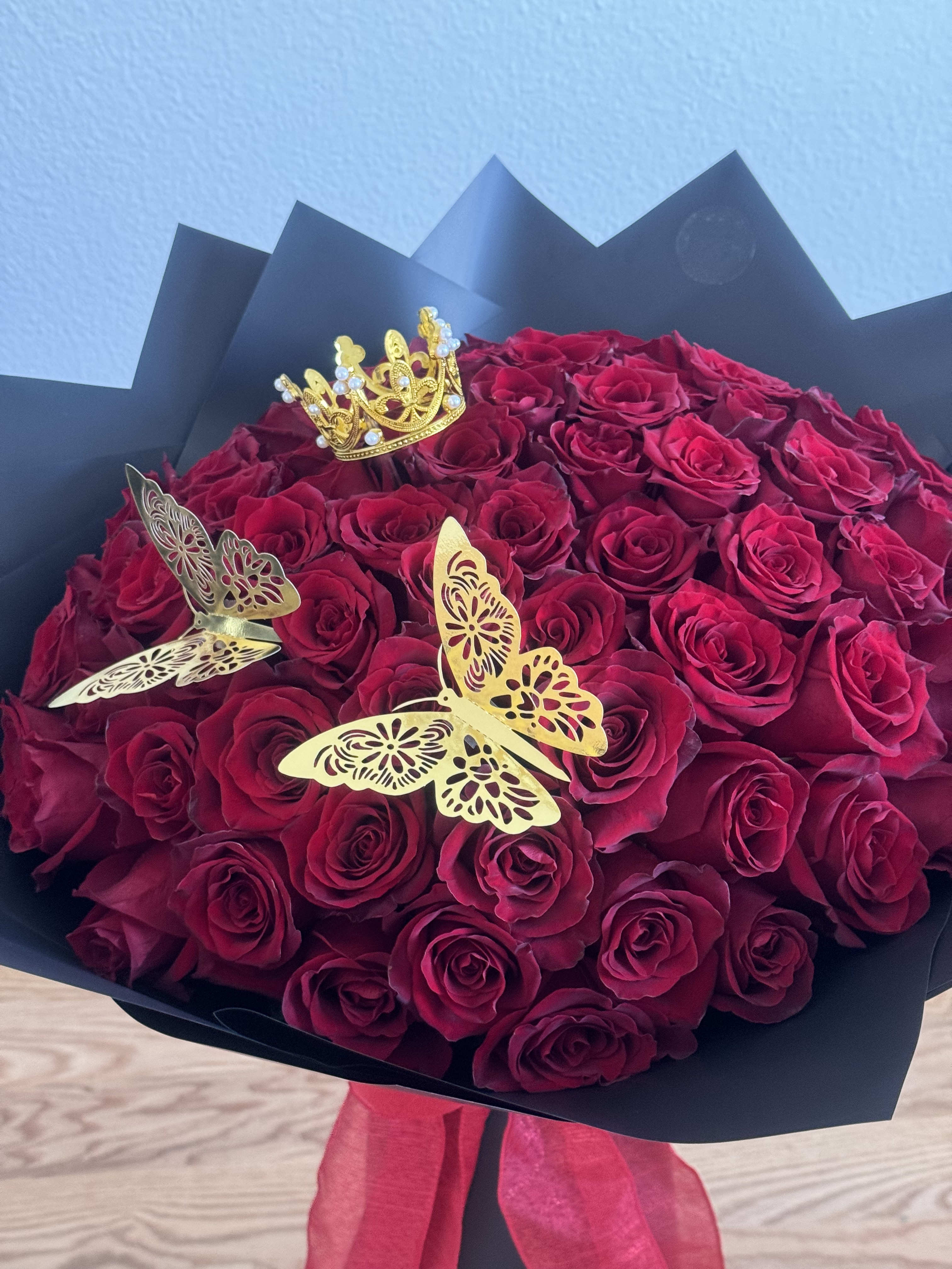 Wrapped in Love  - Looking for a simple yet elegant way to make a lasting impression? Our Wrapped Bouquet is the perfect way to show someone you care! This stunning floral arrangement features Red Ecuadorian Roses beautifully wrapped in delicate floral paper, adding a touch of beauty and sophistication.  The Red Ecuadorian Roses are known for their vibrant color and luscious blooms that exude love, passion and romance. They're stunningly arranged to create a simple yet striking display that will capture the heart of anyone who receives it.  Whether you want to express your love on Valentine's Day, a special anniversary, or just to let someone know how much you care, our Wrapped Bouquet is the perfect choice. There's no better way to say "I love you" than with the beauty and elegance of fresh flowers, wrapped in carefully selected floral paper.  Order your Wrapped Bouquet today and be prepared to receive the most heartfelt thanks!