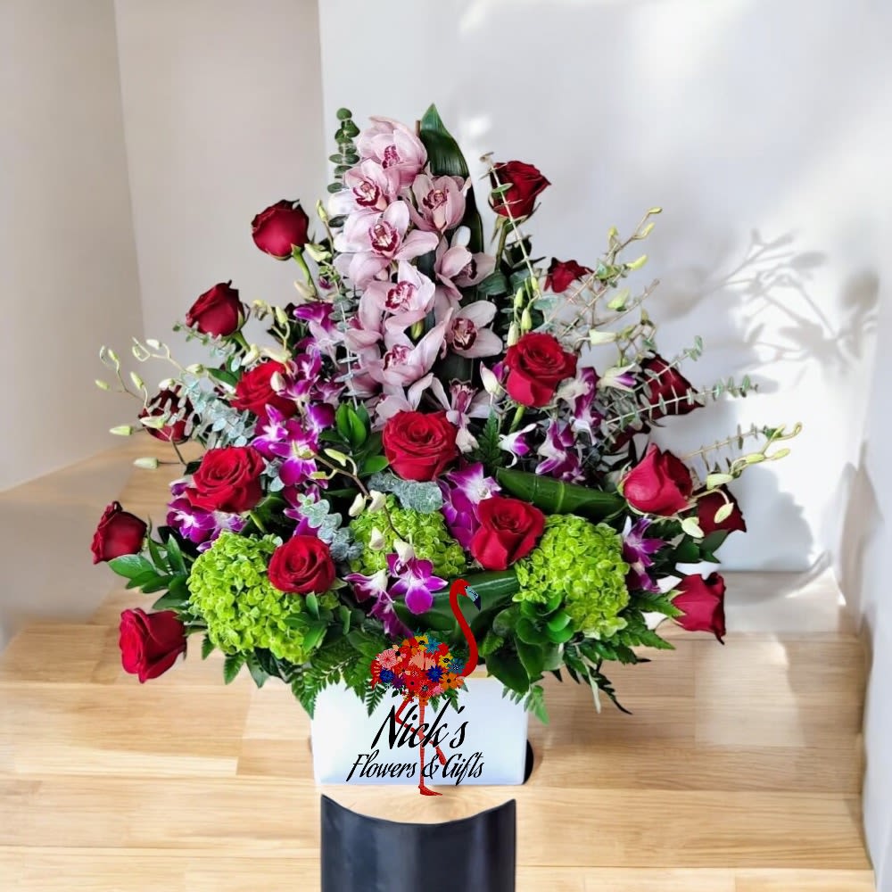 Exquisite Love By Nick - Exquisite love by Nick is a lush arrangement of Red Roses Green Hydrangeas Orchids Cymbidium's and other fresh blooms with lush foliages.