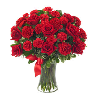 You're In My Heart - Product ID: BF116-11KS  Express the thoughts of togetherness you both share, so clearly, so exquisitely. Red roses and red carnations convey heartfelt emotions, accented by a vivid red ribbon...all superbly arranged in a clear gathering vase. Small Measures 16âH by 14âL. Medium Measures 17âH by 15âL (Shown). Large Measures 18âH by 16âL.