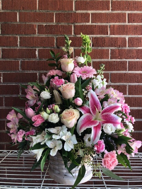 Nana's Basket of Love - A wicker basket of pink and white seasonal flowers. Flowers may vary to florist availability but colors and design will be similar.