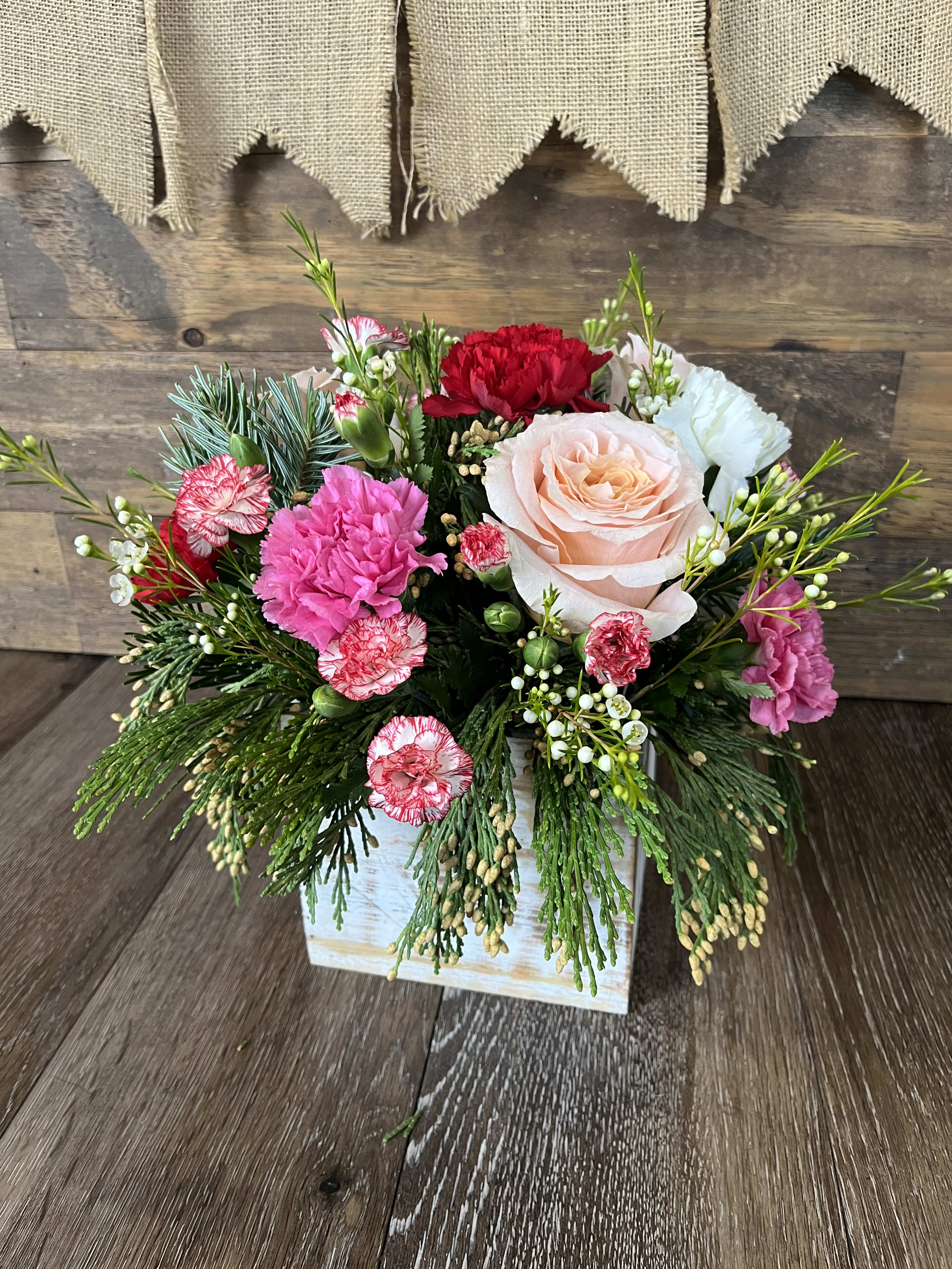 Winter Sparkle  - Beautiful twist on Christmas colors with this pink, red and white arrangement filled with Christmas greens! 