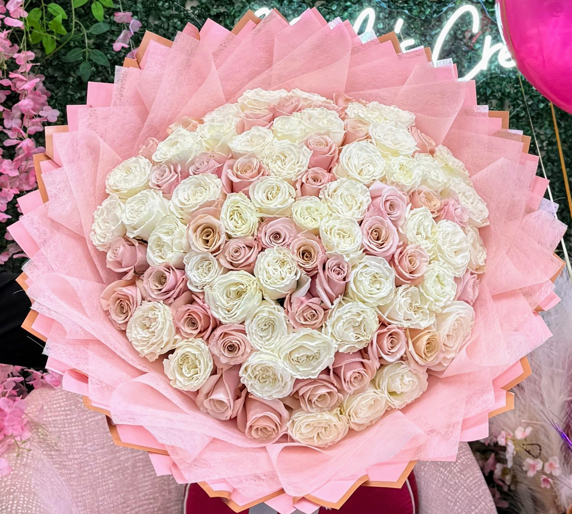 Sweet Blush - STANDARD 50 ROSES DELUXE 75 ROSES PREMIUM 100 ROSES Delicate pink and white flowers come together in this charming hand-tied bouquet. Simply wrapped and full of natural beauty, it’s a timeless choice for any special moment. 