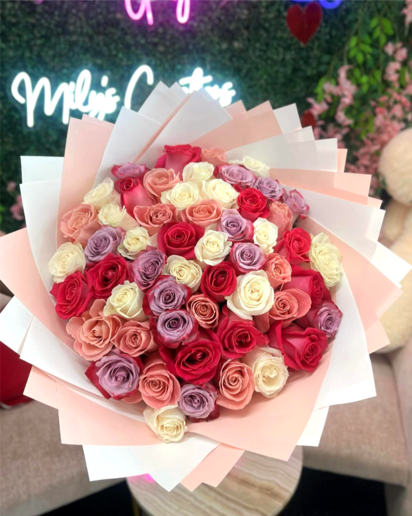 Color Me Happy Bouquet - STANDARD 24 ROSES DELUXE 36 ROSES PREMIUM 50 ROSES A playful and radiant assortment of colorful blooms that captures the beauty of variety and joy. Guaranteed to bring smiles. THE ARRANGEMENT ON THE PHOTO HAS 50 ROSES