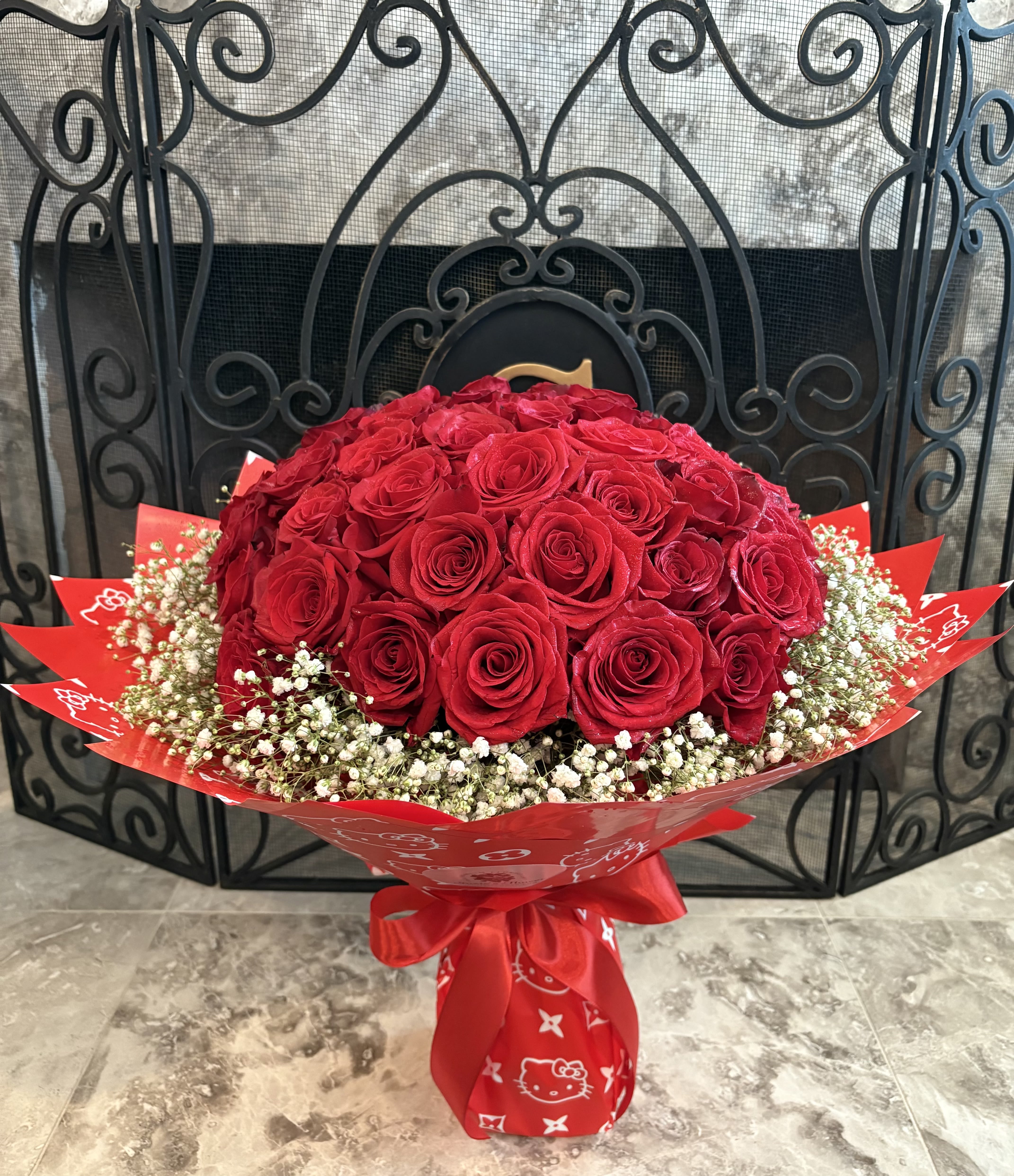 50 Stems Red Roses On Promotion - 50 Stems Fresh Cut Red Roses With Baby Breath In  Special Design Paper. The Design Paper's Pattern May Be Different Depends on Available.