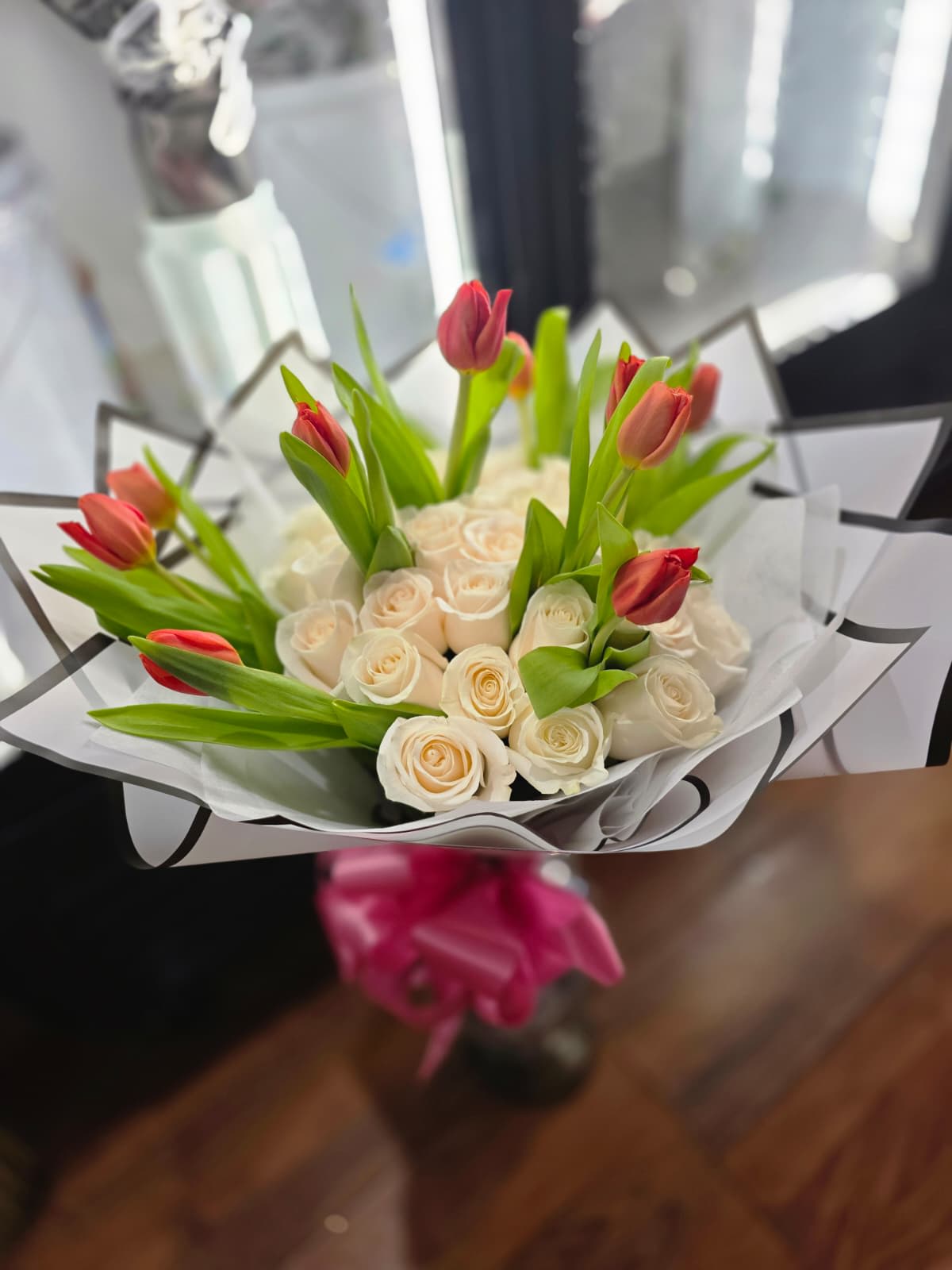 Love is in the Air - This bouquet of roses and tulips is an elegant combination that unites the passionate love of roses with the fresh and renewing beauty of tulips, creating a message of love, appreciation, joy, and renewal. This bouquet is ideal for showing someone how much you care.