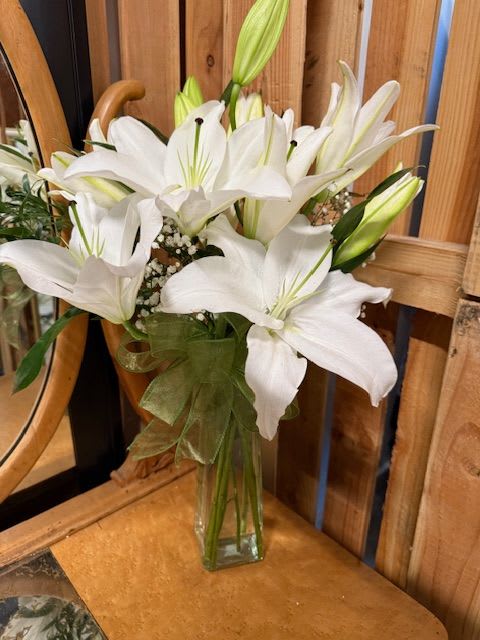 Lilies, Lilies, Lilies - Elegant and Fragrant. White Casa Blanca Oriental Lily blooms arranged in a vase.