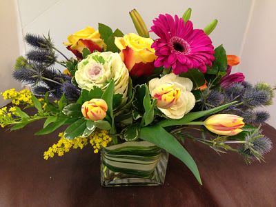 Blooms Garden  (Picture is Deluxe) - Kale, Orange Lilies, Roses, Gerbera Daisies, Thistle, Solidago