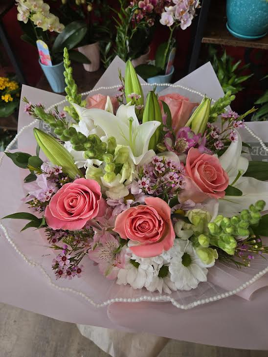 Korean Wrapped series - Pink Mixed - Light pink roses are on display in this lovely mixed arrangement, wrapped in Korean Paper with a sheer bow. 