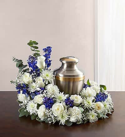 Peace  Blue and White Urn -  Peace cremation arrangement that encompasses the urn of your choice. This classy arrangement features heavenly white &amp; blue  hues with lavish hydrangeas, lilies, and roses, making it ideal for any memorial service. Urn Not Included 
