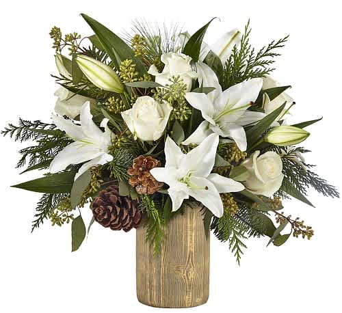 Joyous Greetings Bouquet -  The Joyous Greetings Bouquet is an elegant collection of ivory, cream, and green hues. Handcrafted with classic roses, Oriental lilies, and assorted Christmas greens, this bouquet brings the holiday cheer with each petal.