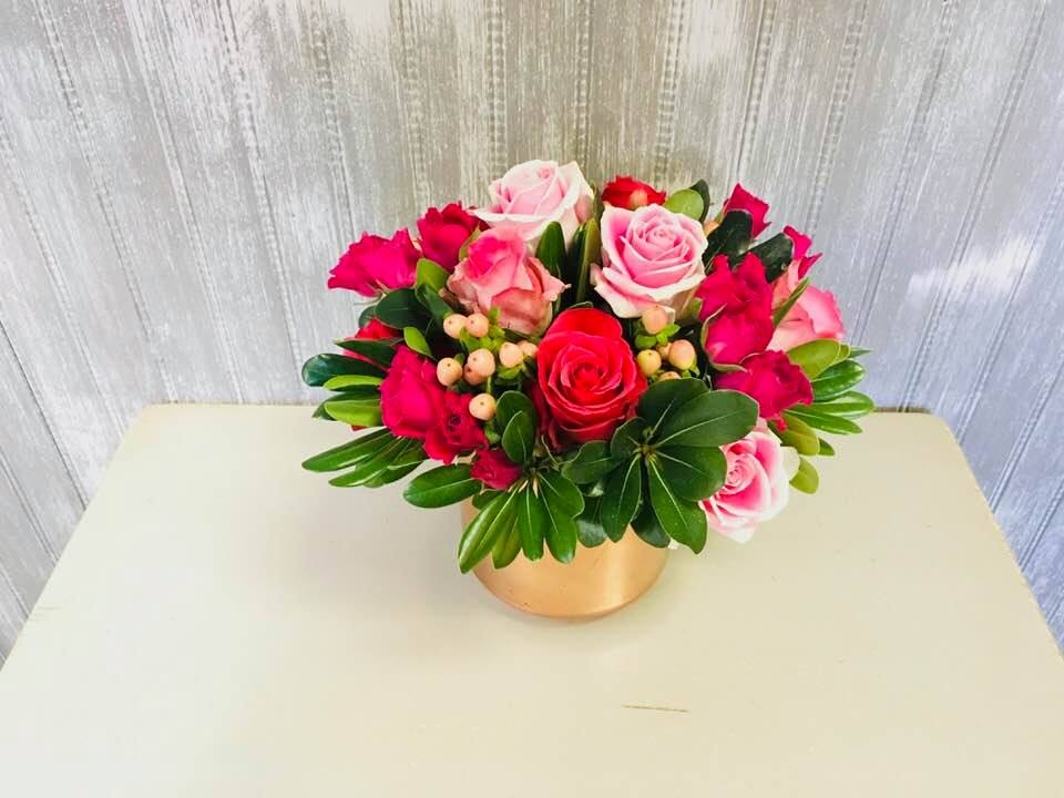 Heavenly Spring - A beautiful rose gold vase with shades of pink roses and spray roses. 