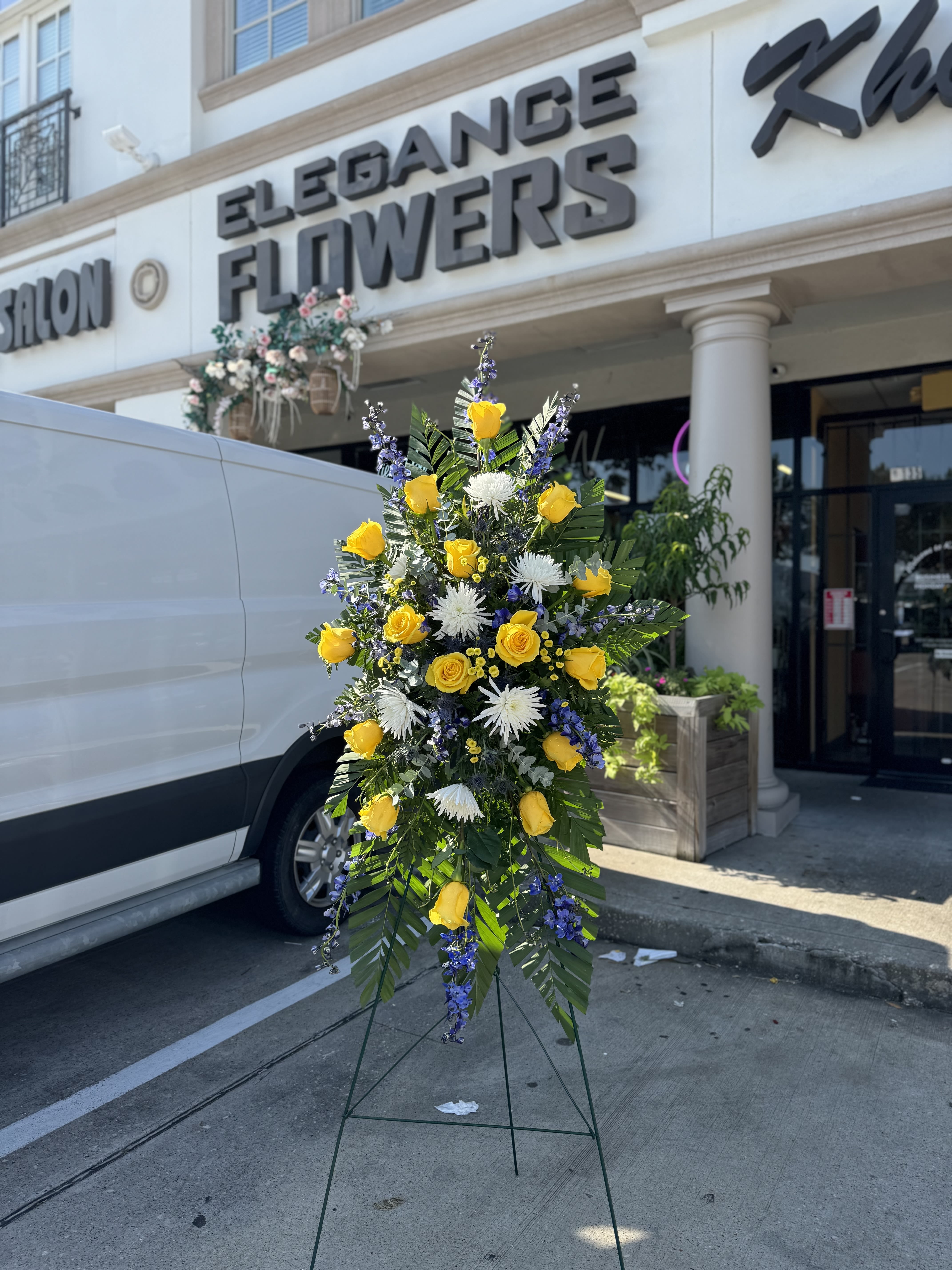 Easel #21 Online - A standings flower arrangement for a funeral service is a heartfelt tribute designed to honor and celebrate the life of the deceased. These arrangements are typically displayed on an easel or stand, making them highly visible and a central part of the memorial decor. 