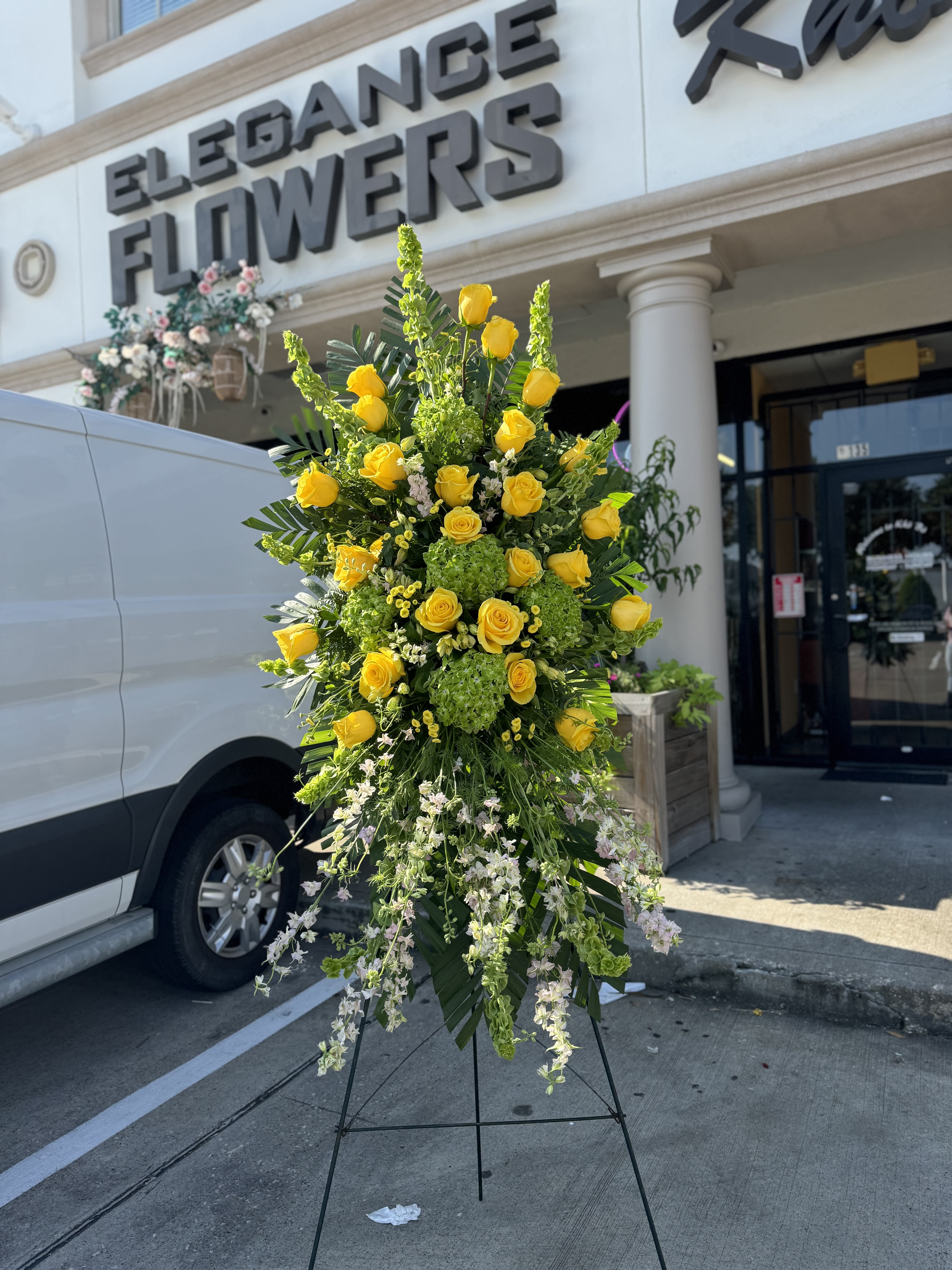 Easel #20 Online - A standings flower arrangement for a funeral service is a heartfelt tribute designed to honor and celebrate the life of the deceased. These arrangements are typically displayed on an easel or stand, making them highly visible and a central part of the memorial decor. 